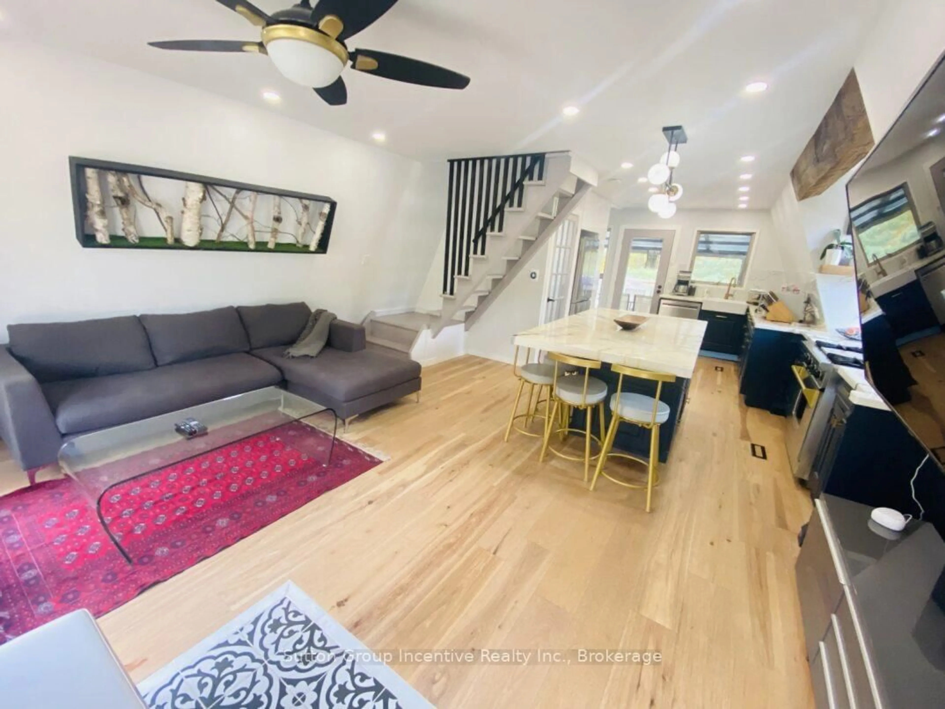 Living room with furniture, wood/laminate floor for 203 Park Rd, Tiny Ontario L0L 1P1