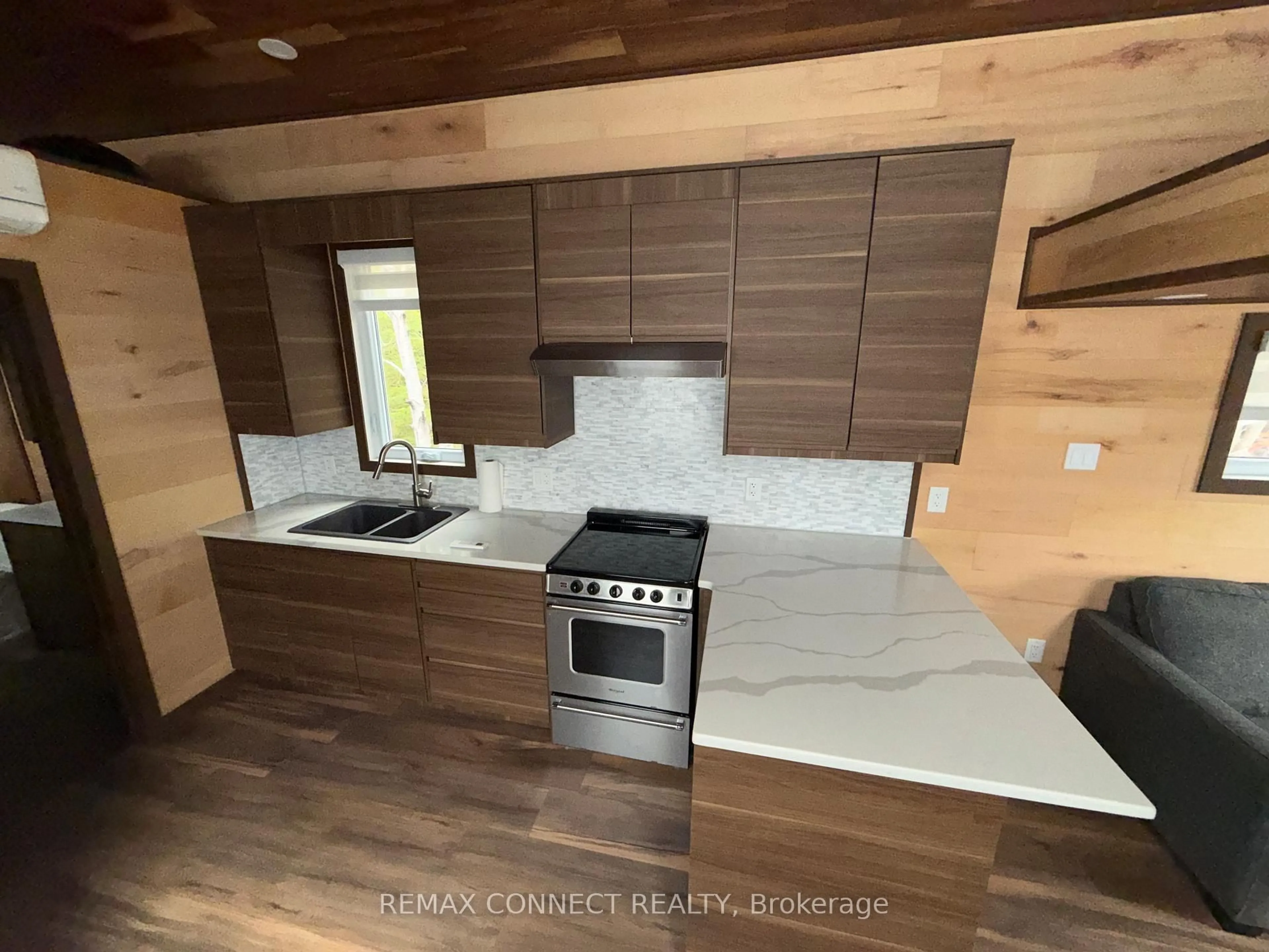 Open concept kitchen, wood/laminate floor for 4750 Side Road 5 #(1), Ramara Ontario L3V 0T2