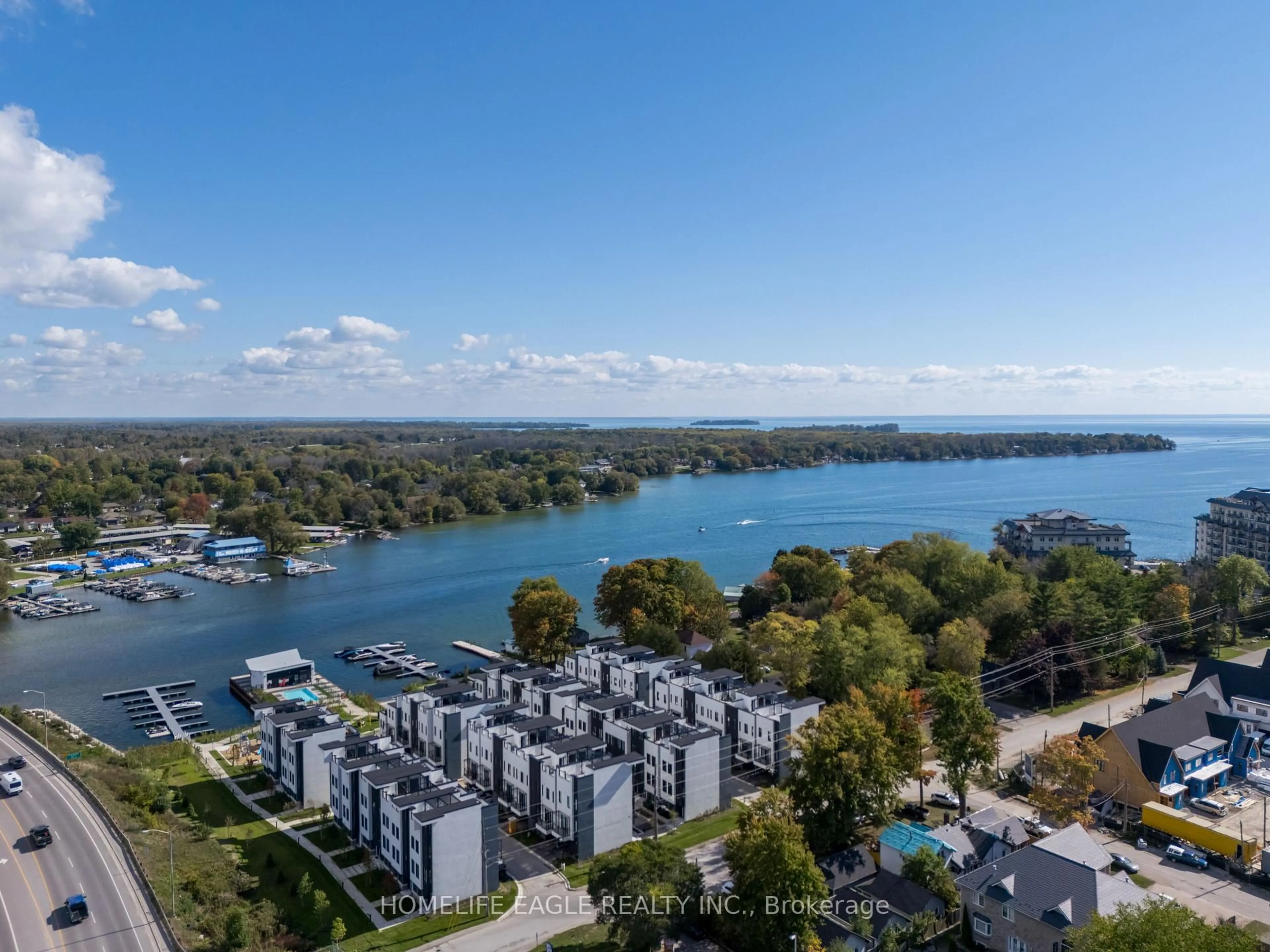 A pic from outside/outdoor area/front of a property/back of a property/a pic from drone, water/lake/river/ocean view for 2 Mariner's Pier Way, Orillia Ontario L3V 8P4