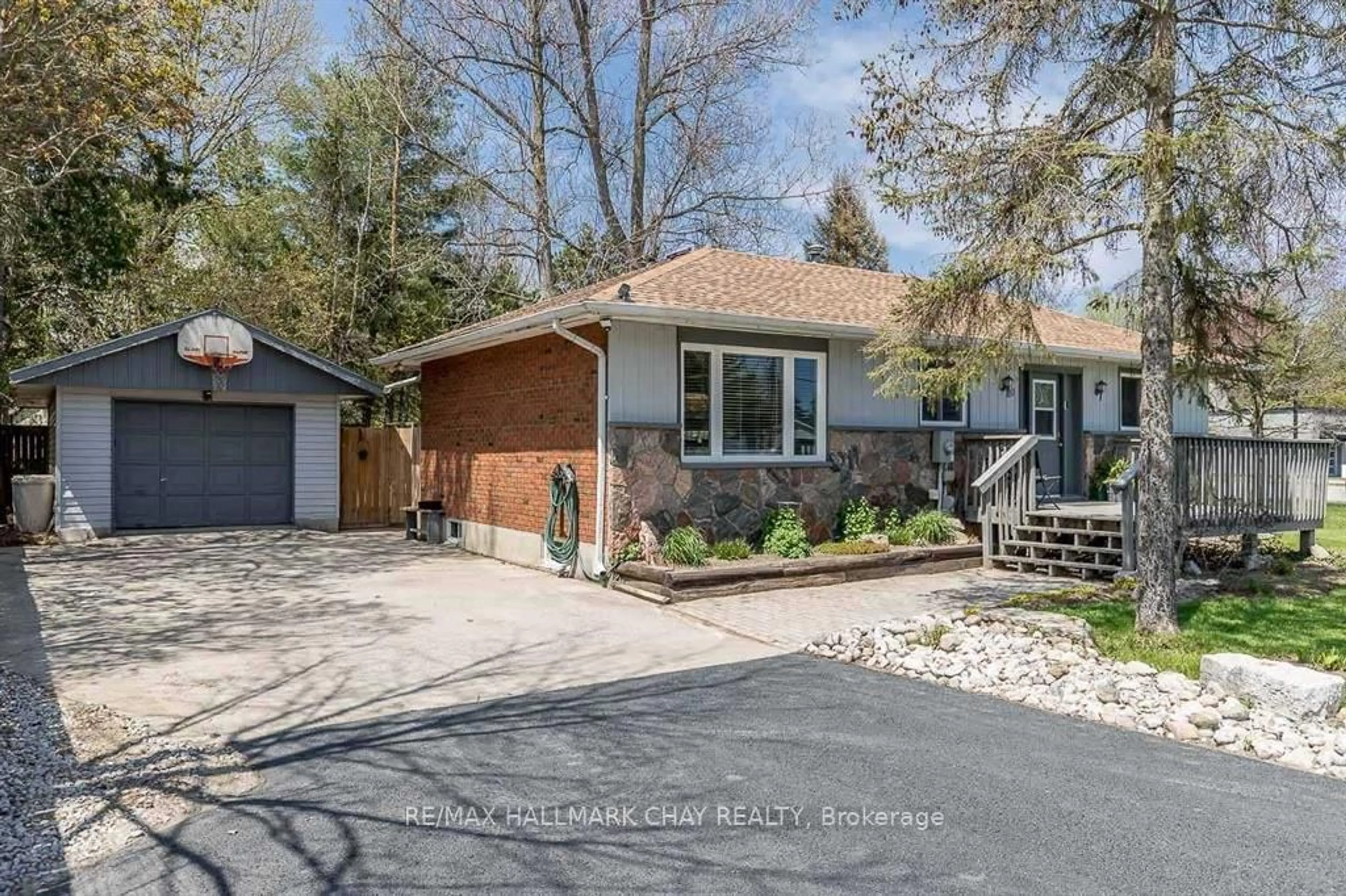 Home with brick exterior material, street for 10 Finlay Mill Rd, Springwater Ontario L0L 1X0