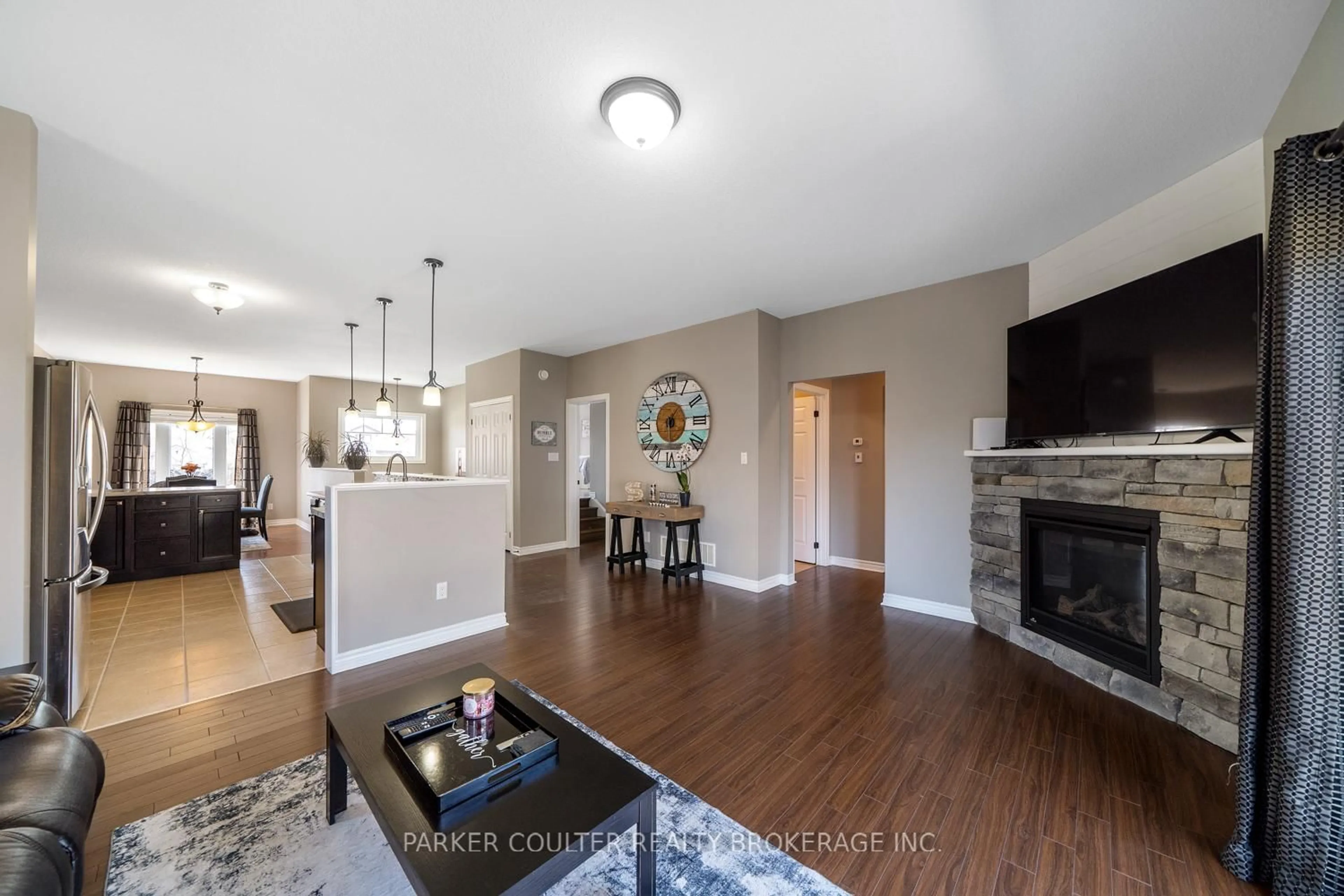 Living room with furniture, wood/laminate floor for 219 Centre St, Clearview Ontario L0M 1S0