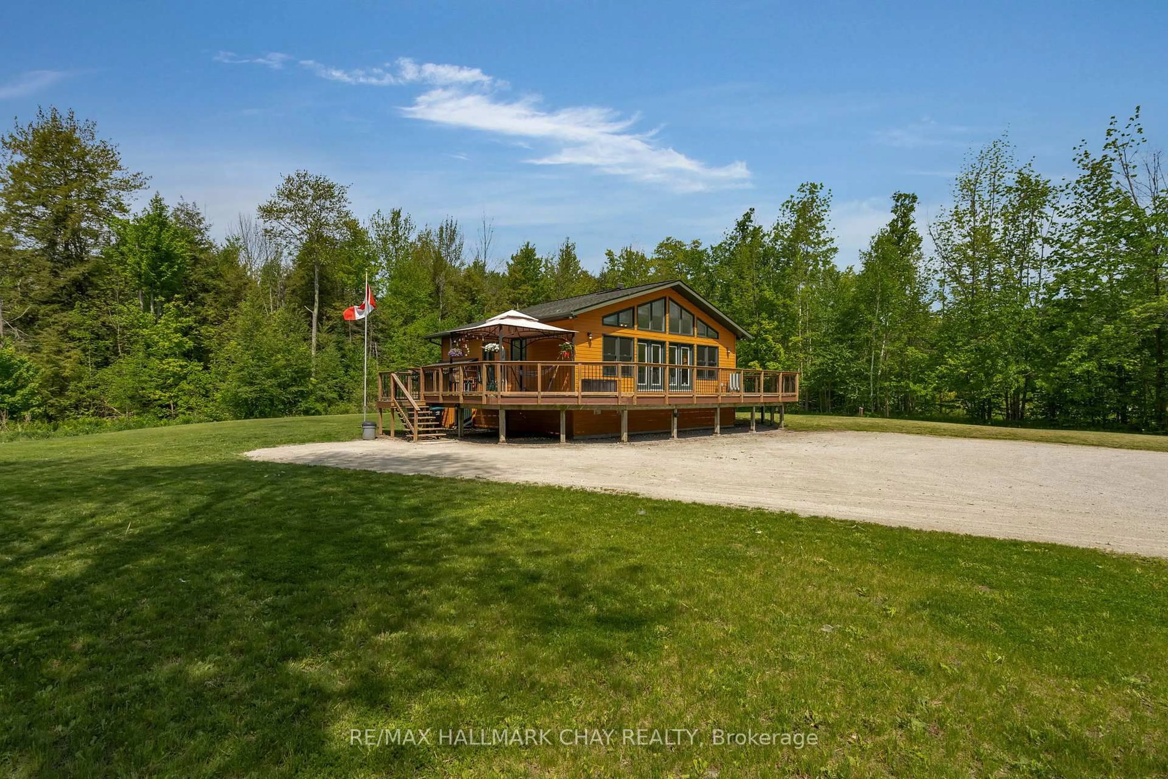 A pic from outside/outdoor area/front of a property/back of a property/a pic from drone, unknown for 13790 County 27 Rd, Springwater Ontario L0L 2K0