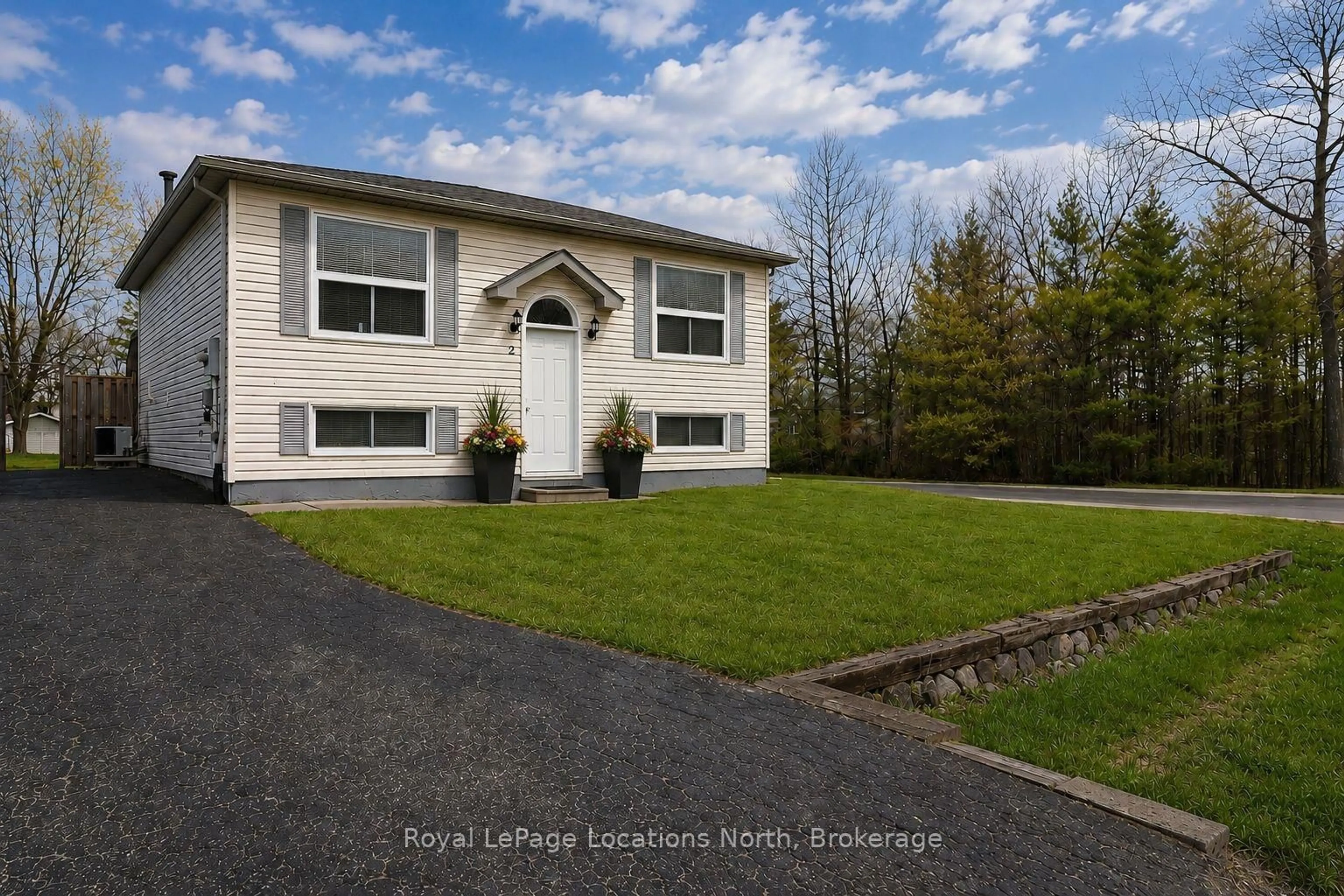 Home with vinyl exterior material, street for 2 Langevin Dr, Wasaga Beach Ontario L9Z 1C6