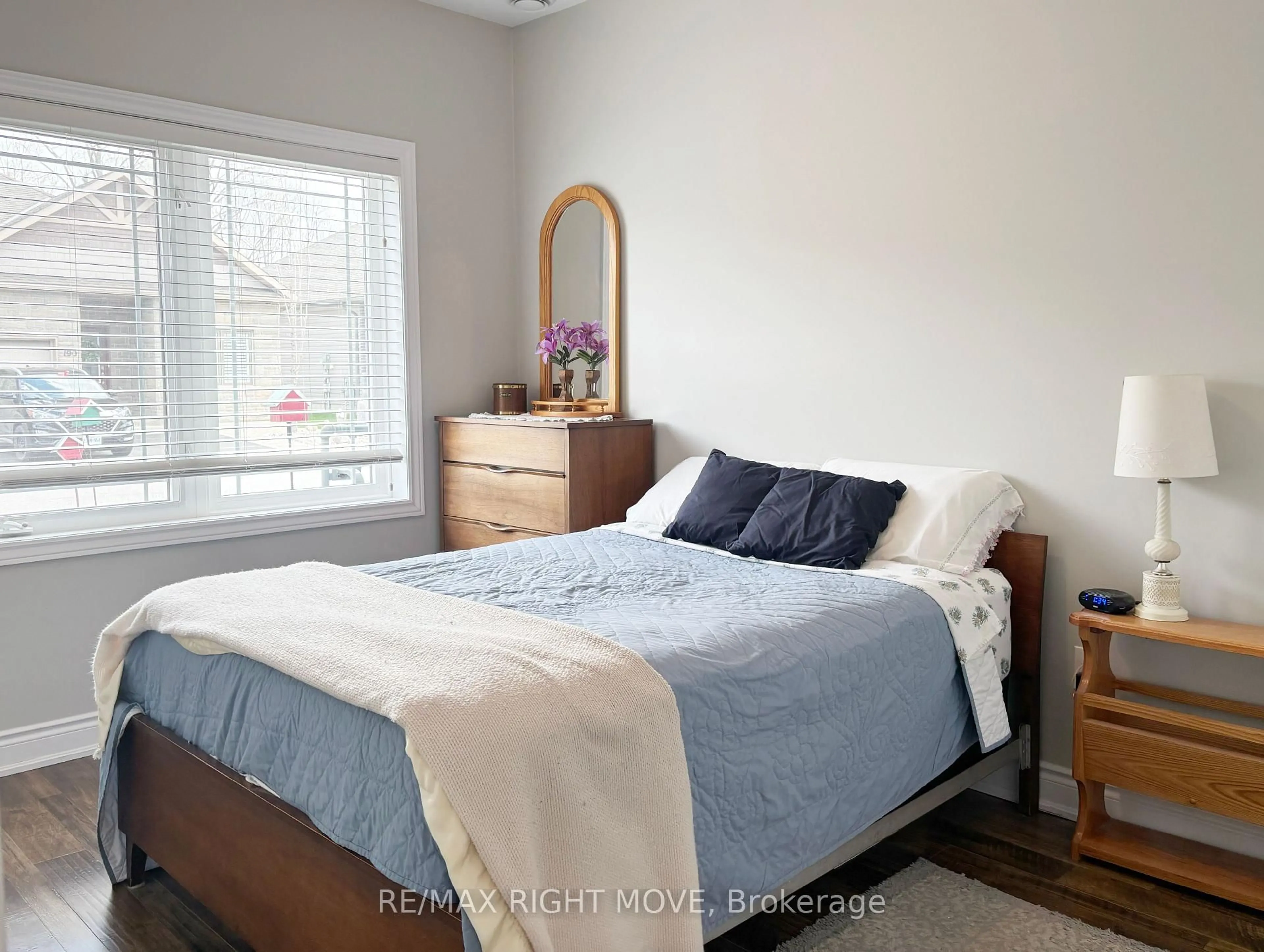 Bedroom with bed, wood/laminate floor for 195 Lucy Lane, Orillia Ontario L3V 0G3