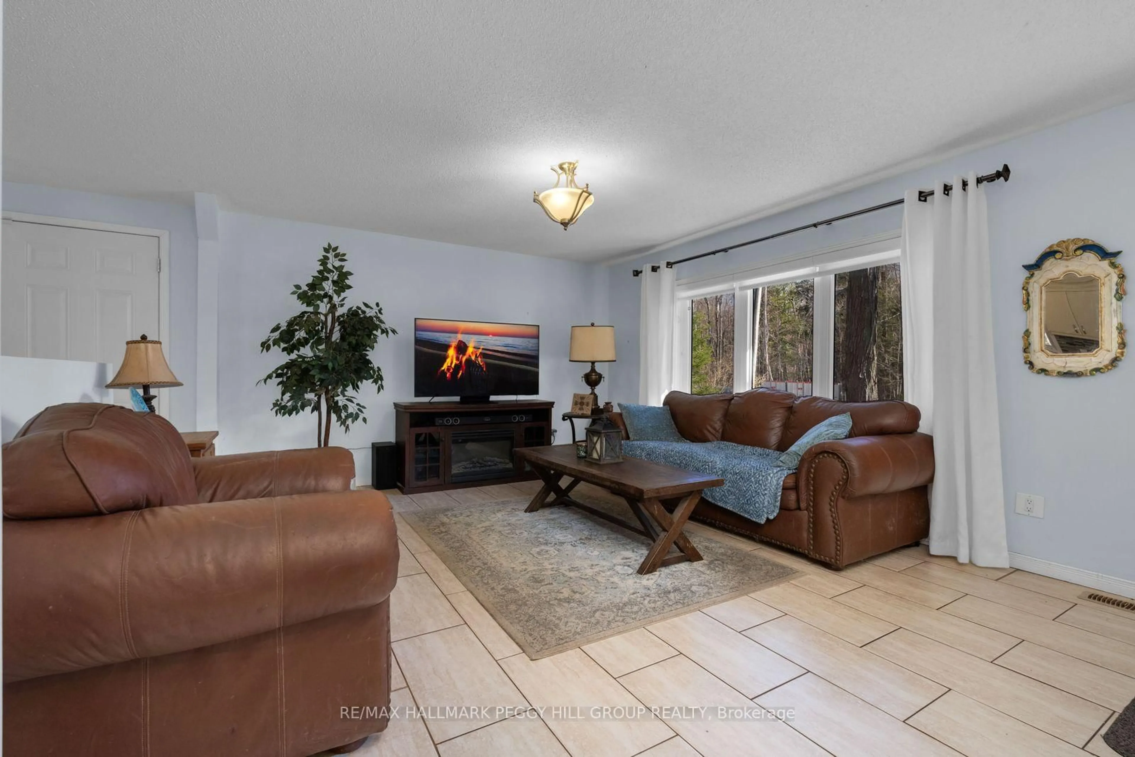 Living room with furniture, ceramic/tile floor for 144 Trout Lane, Tiny Ontario L9M 0J1