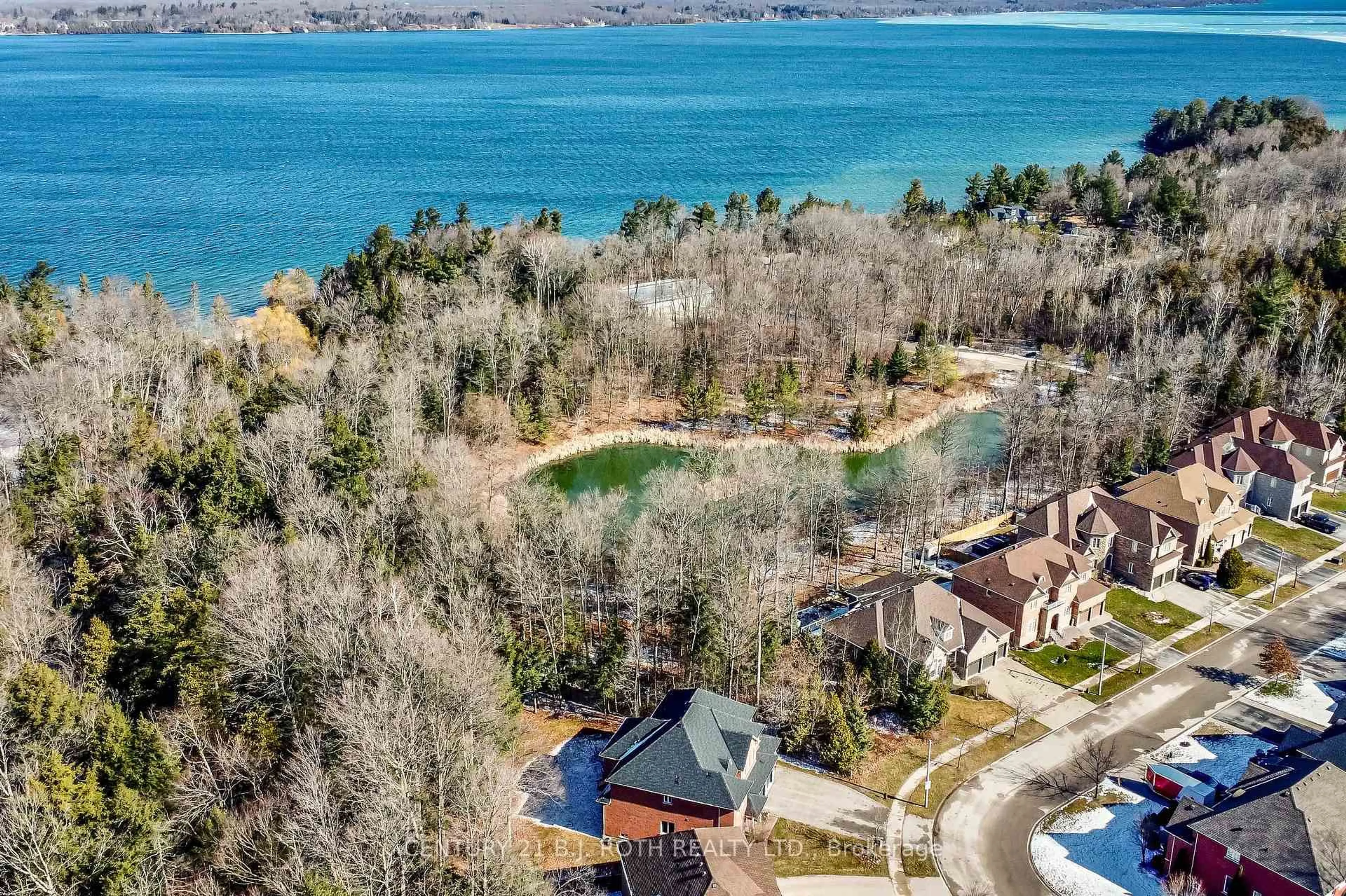 A pic from outside/outdoor area/front of a property/back of a property/a pic from drone, water/lake/river/ocean view for 38 Camelot Sq, Barrie Ontario L4M 0C3