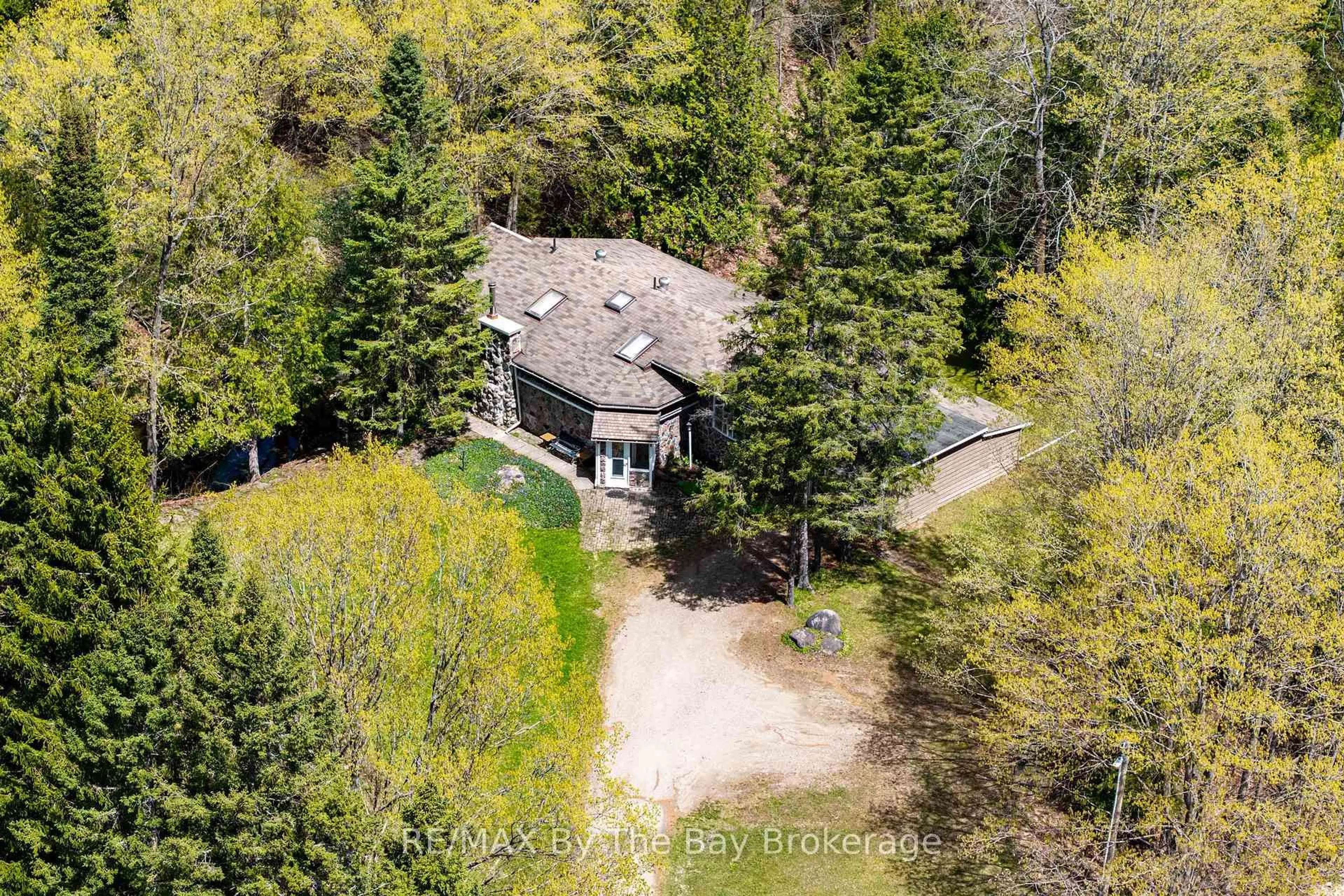 A pic from outside/outdoor area/front of a property/back of a property/a pic from drone, forest/trees view for 8308 County Road 9, Clearview Ontario L0M 1G0