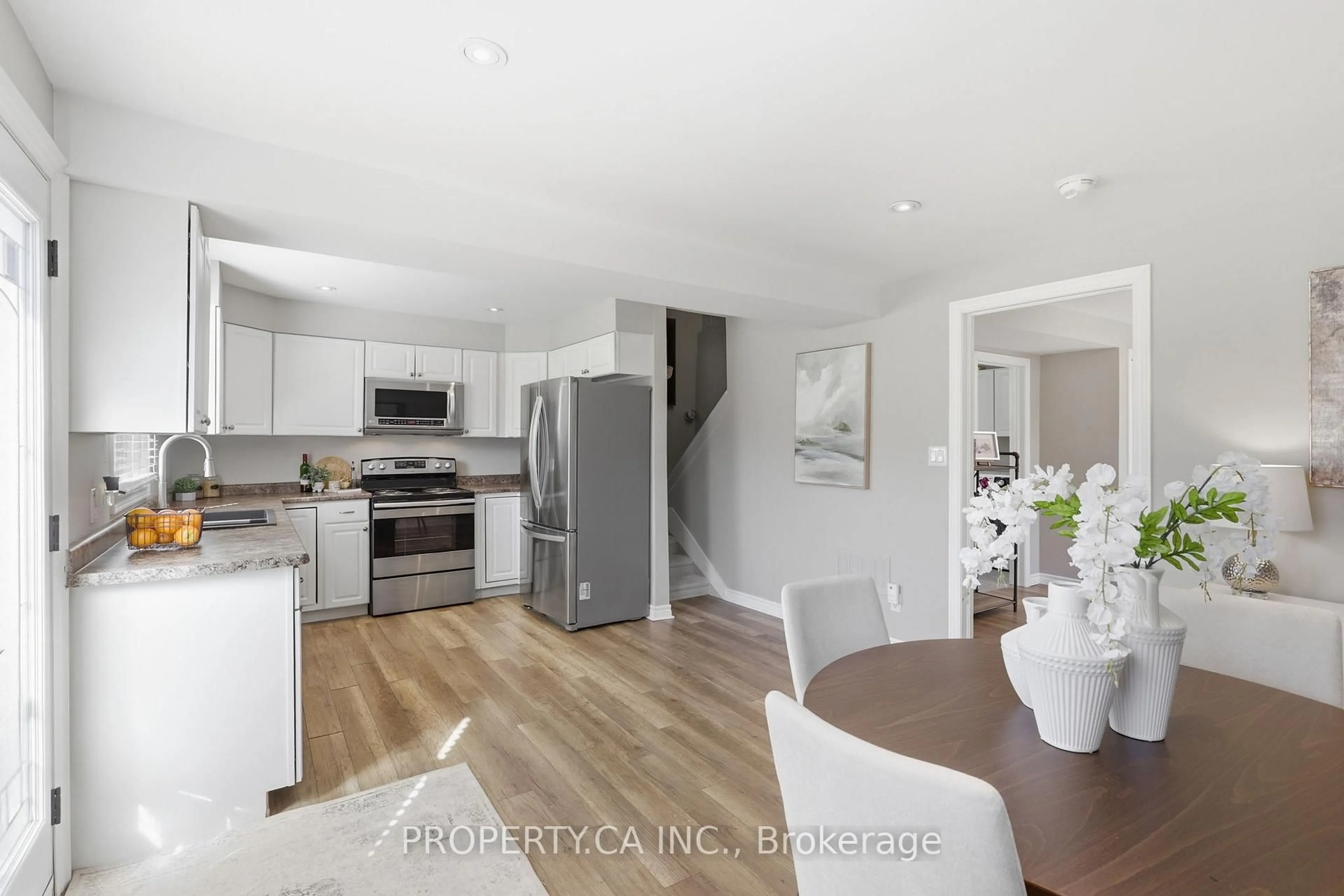 Open concept kitchen, wood/laminate floor for 96 Ardagh Rd, Barrie Ontario L4N 9B7