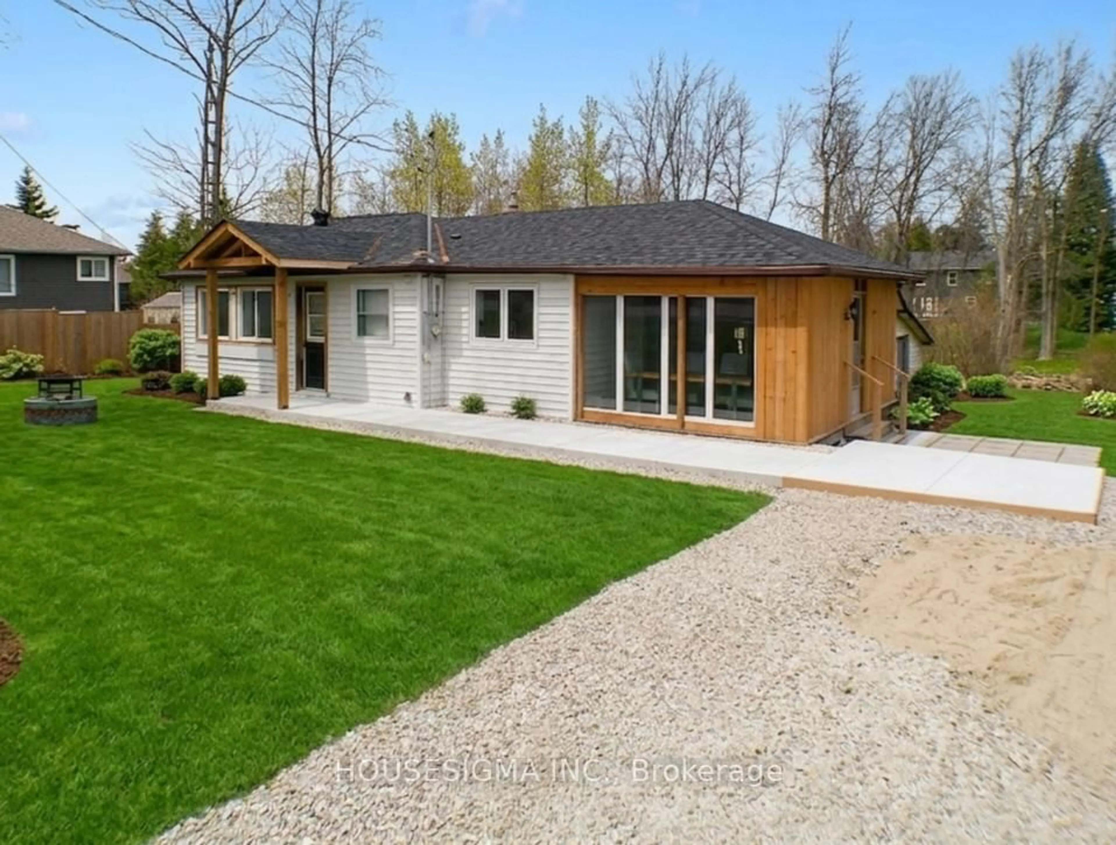 Home with brick exterior material, street for 8892 Beachwood Rd, Wasaga Beach Ontario L9Z 2Y5