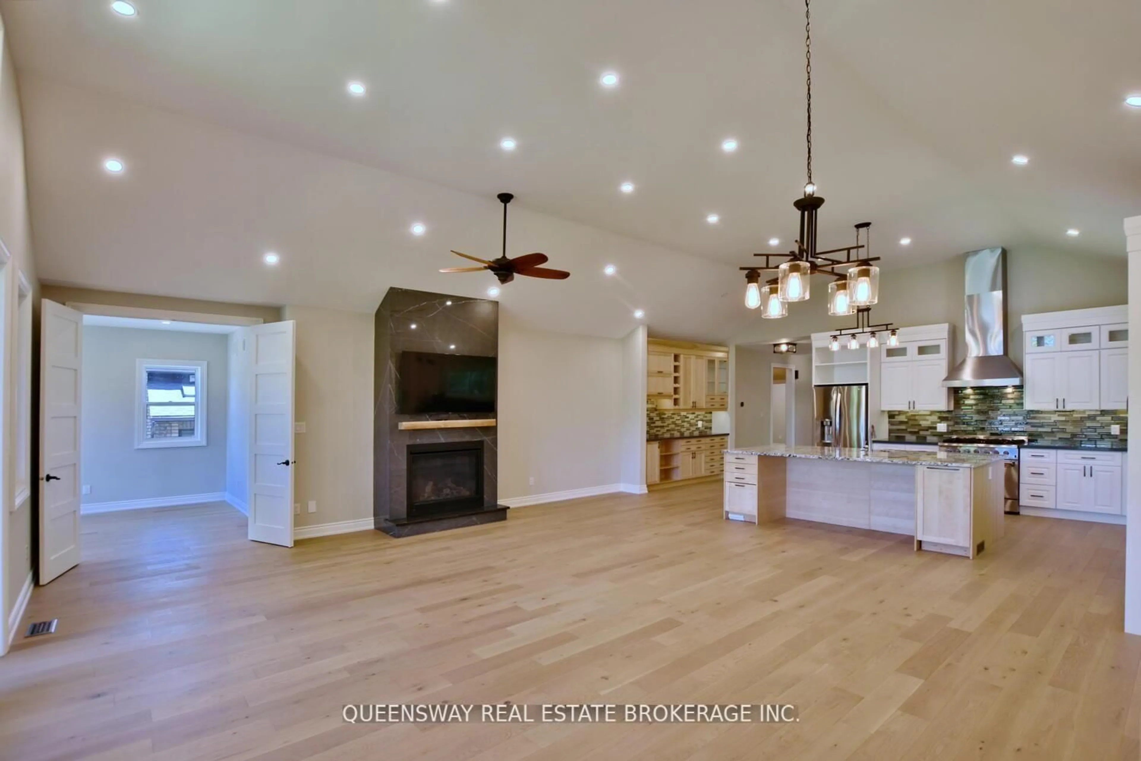 Open concept kitchen, wood/laminate floor for 1852 River Rd, Wasaga Beach Ontario L9Z 1K9