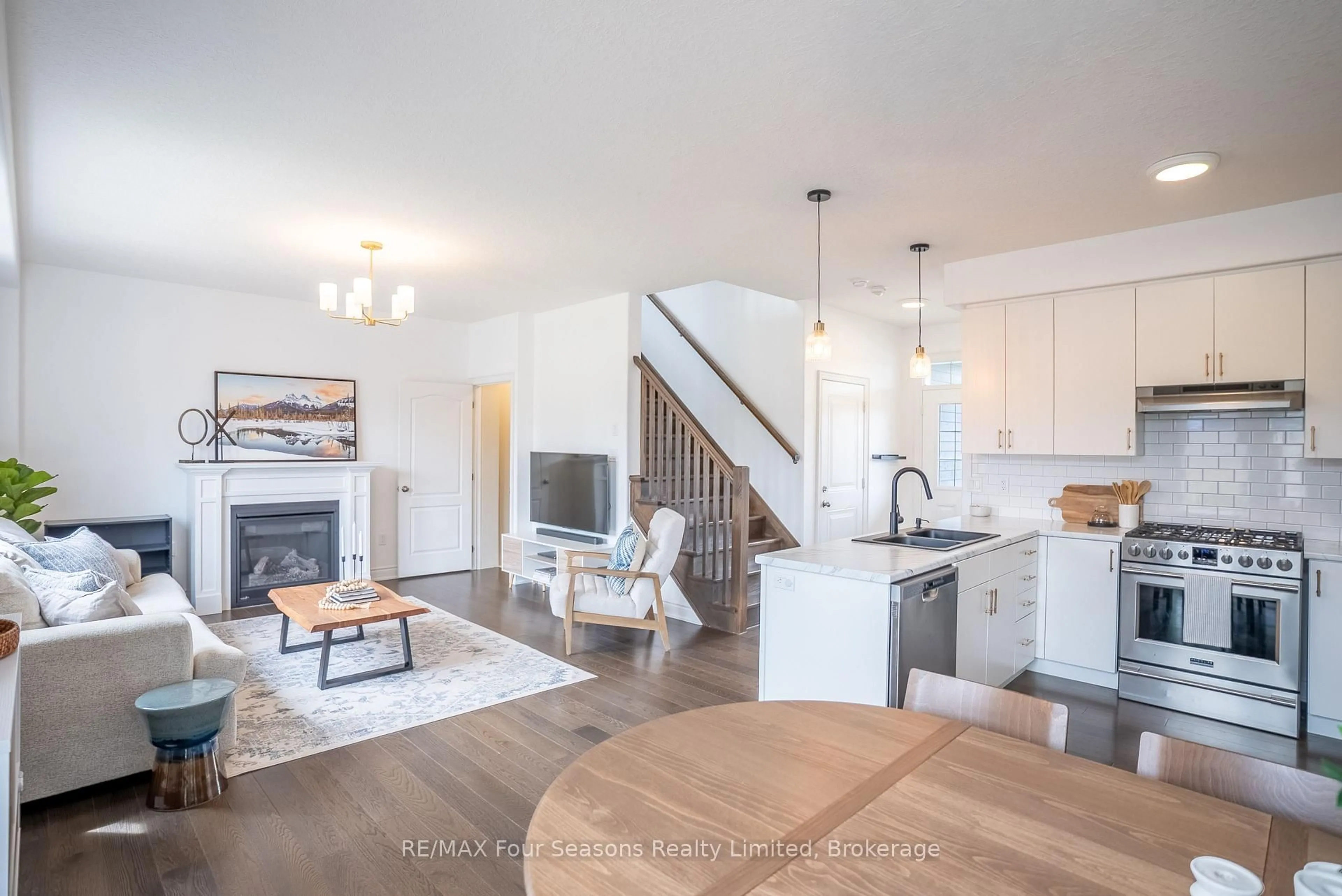 Open concept kitchen, wood/laminate floor for 107 LOCKERBIE Cres, Collingwood Ontario L9Y 4S1