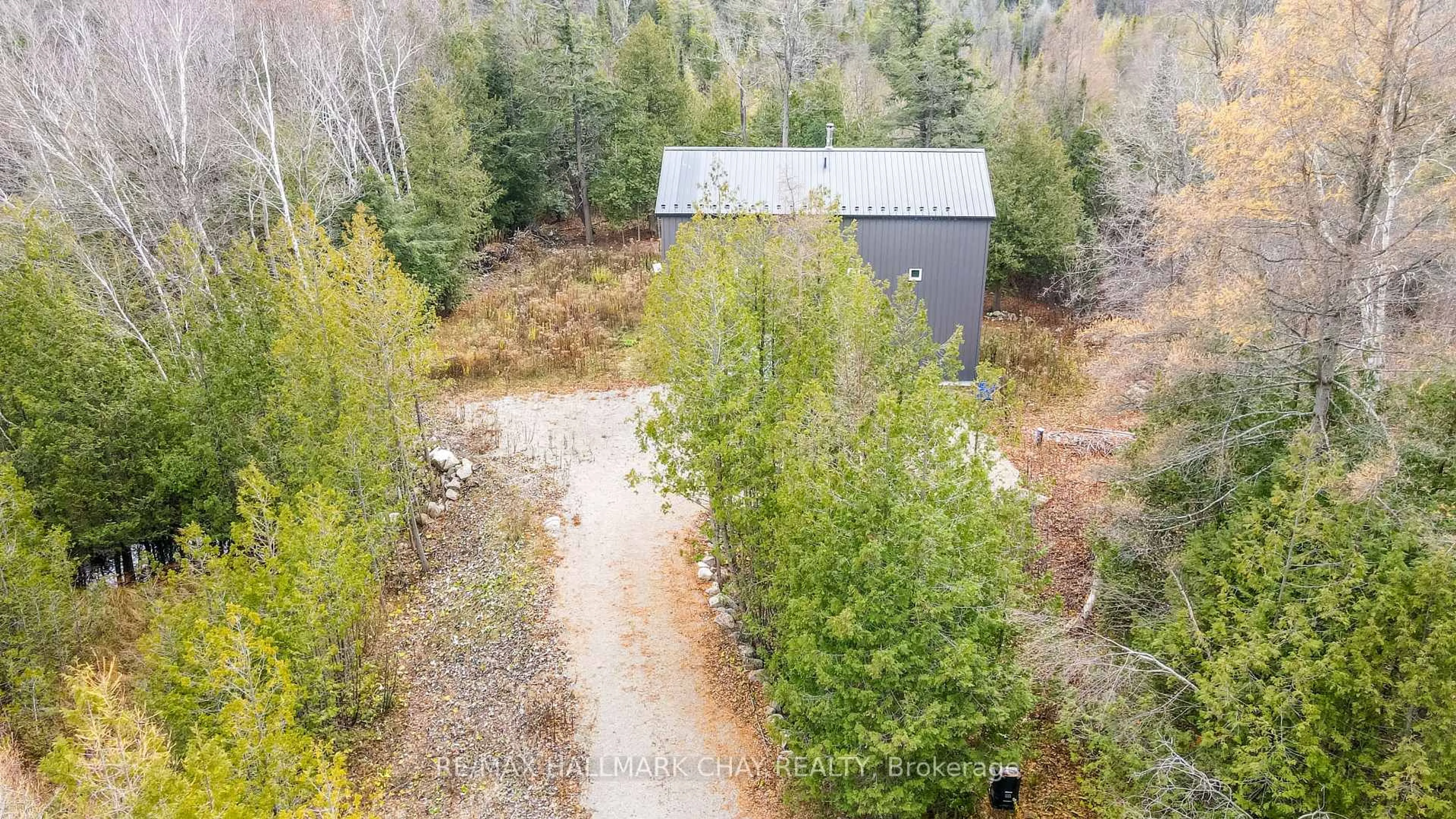 A pic from outside/outdoor area/front of a property/back of a property/a pic from drone, forest/trees view for 2576 Champlain Rd, Tiny Ontario L9M 0C9