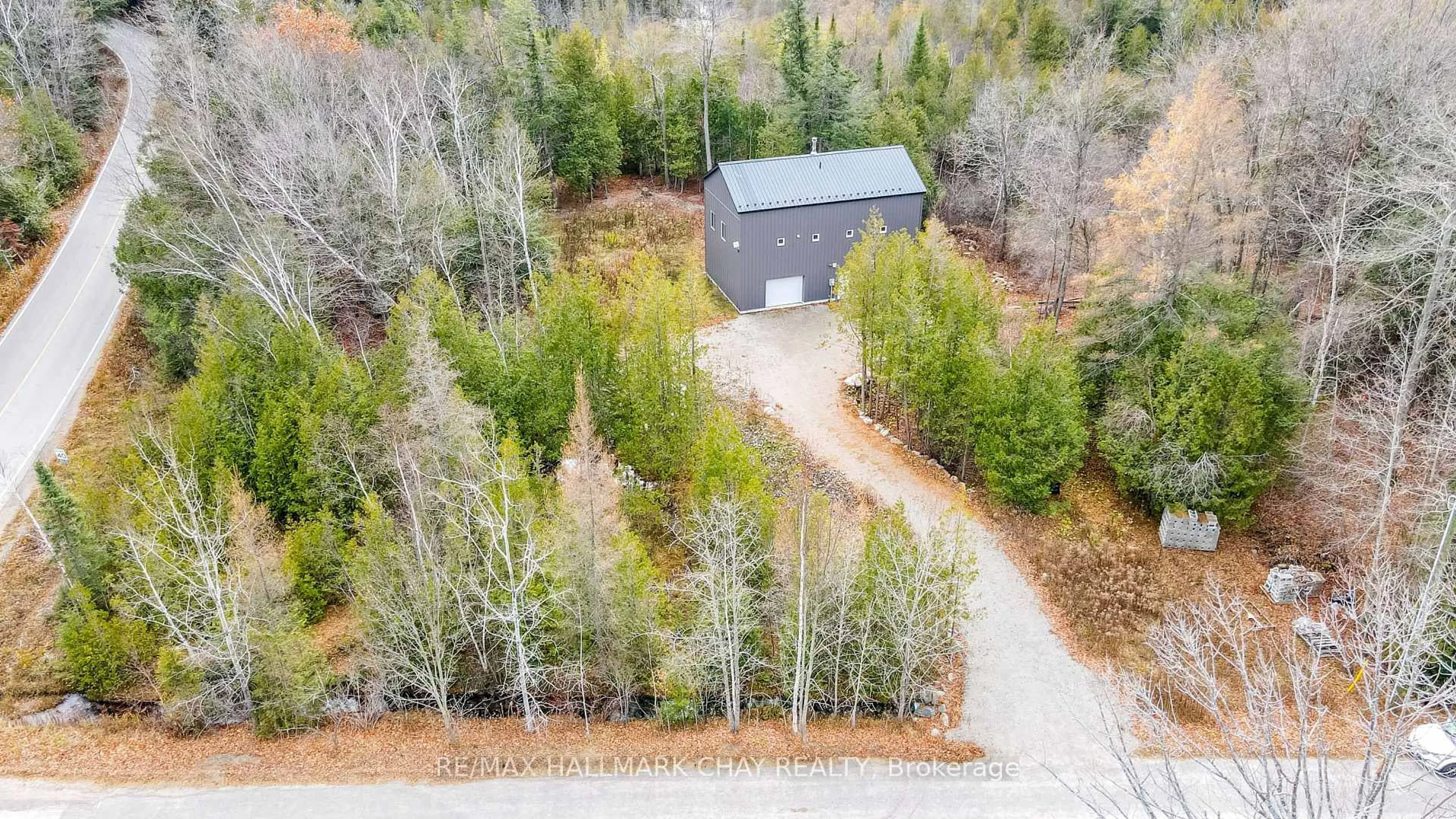 A pic from outside/outdoor area/front of a property/back of a property/a pic from drone, forest/trees view for 2576 Champlain Rd, Tiny Ontario L9M 0C9
