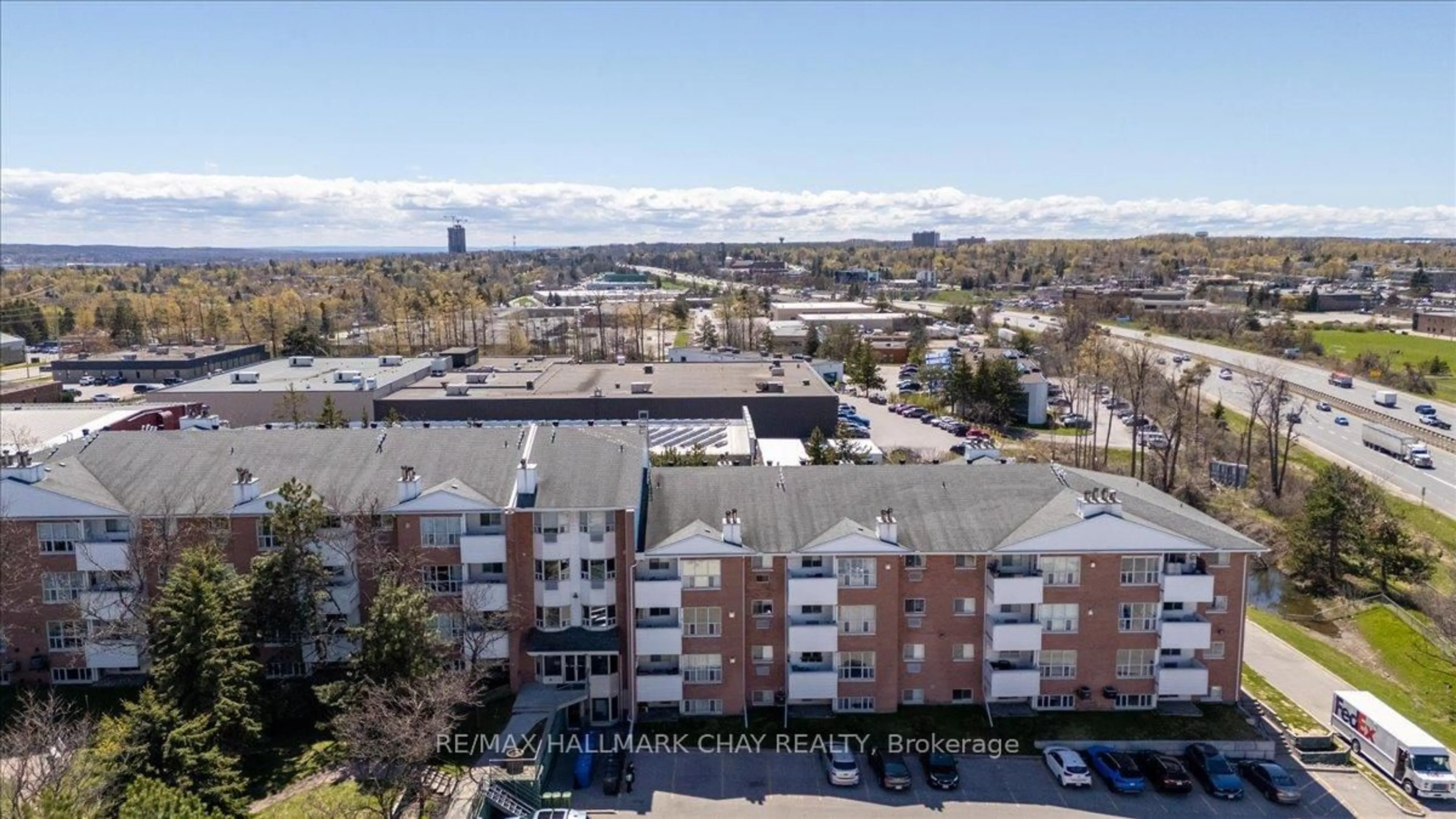A pic from outside/outdoor area/front of a property/back of a property/a pic from drone, city buildings view from balcony for 120 Bell Farm Rd #201, Barrie Ontario L4M 6J2