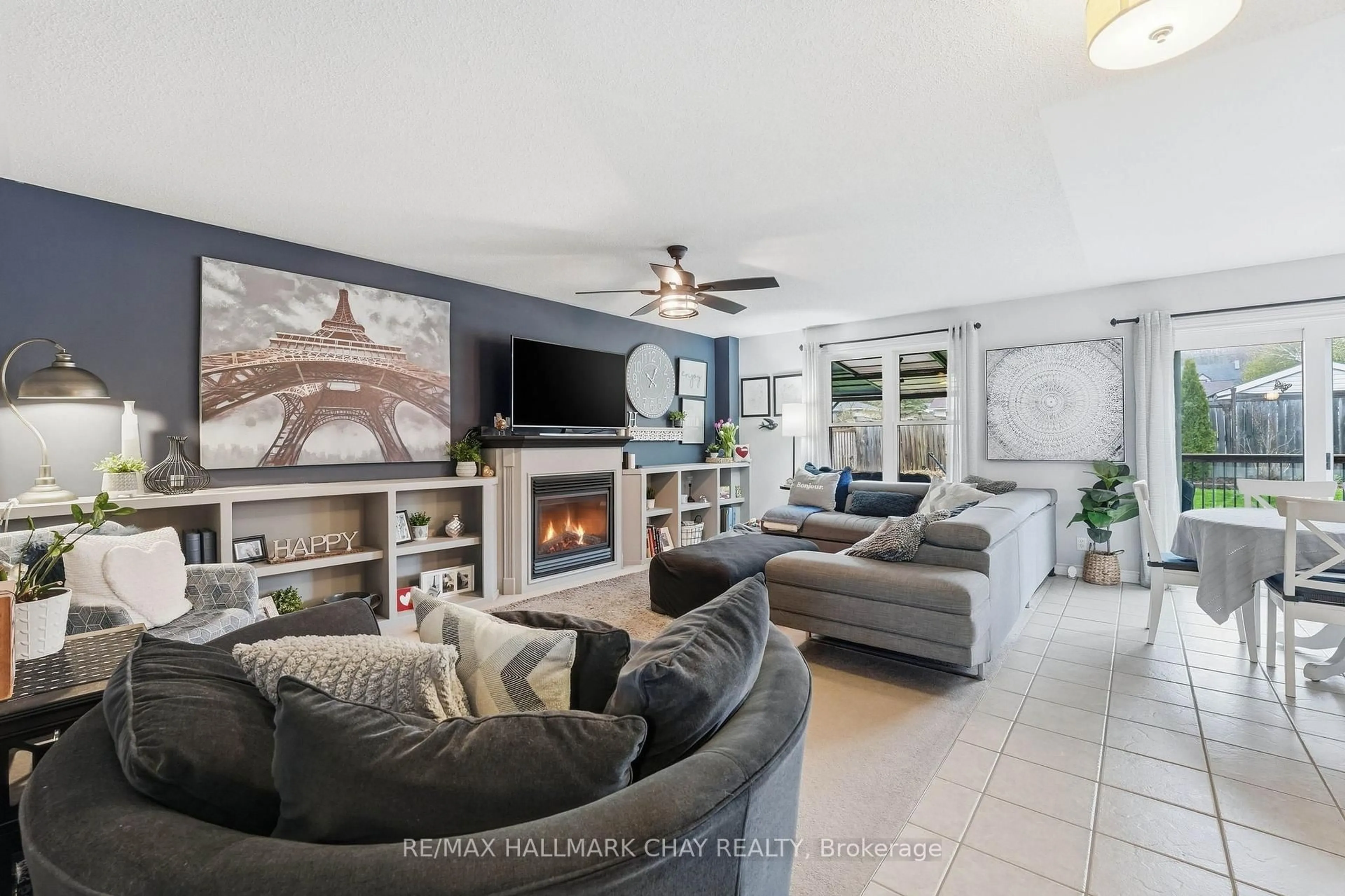 Living room with furniture, ceramic/tile floor for 94 Ruffet Dr, Barrie Ontario L4N 0N7