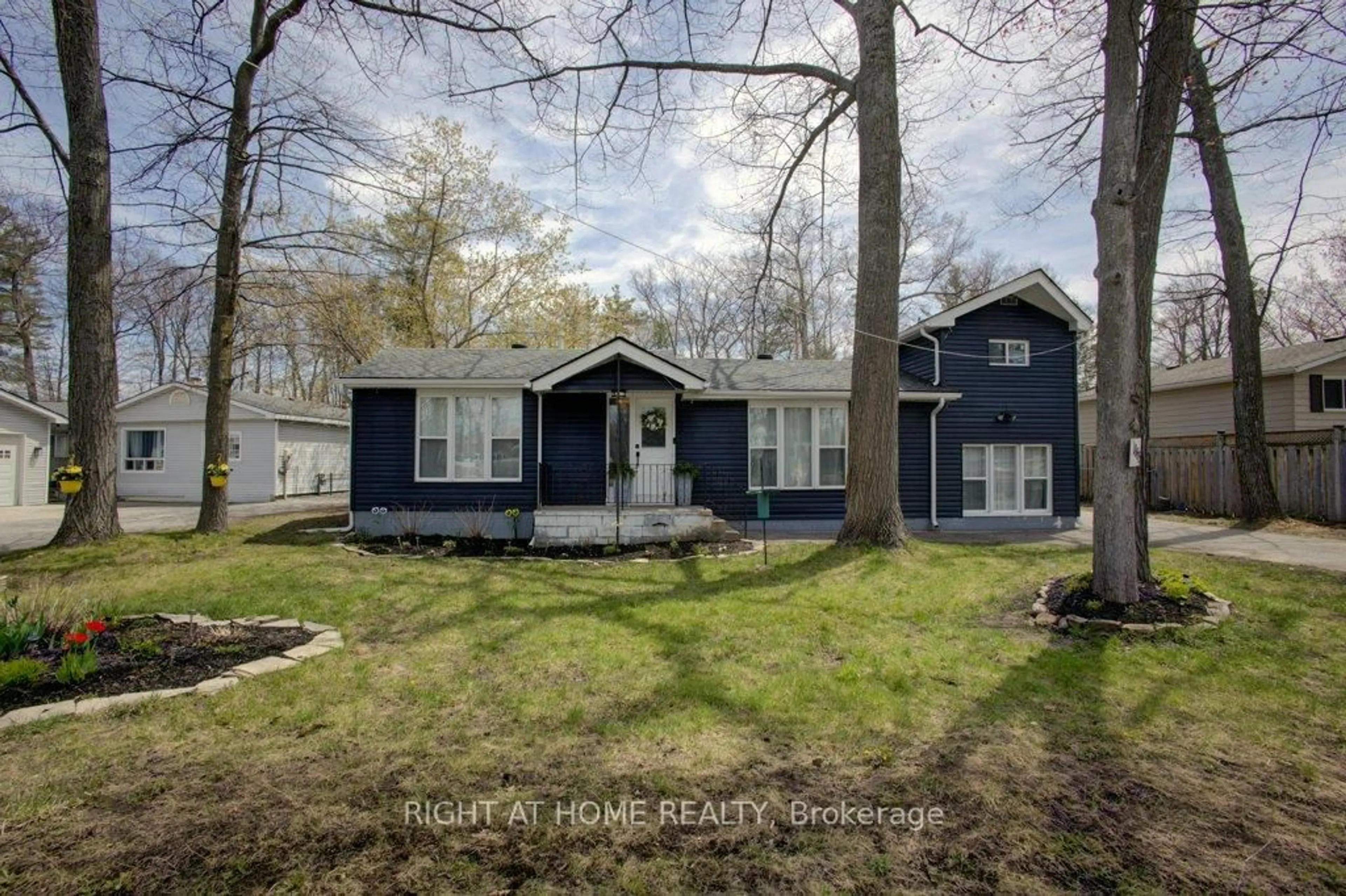 Home with vinyl exterior material, street for 1865 River Rd, Wasaga Beach Ontario L9Z 1L1