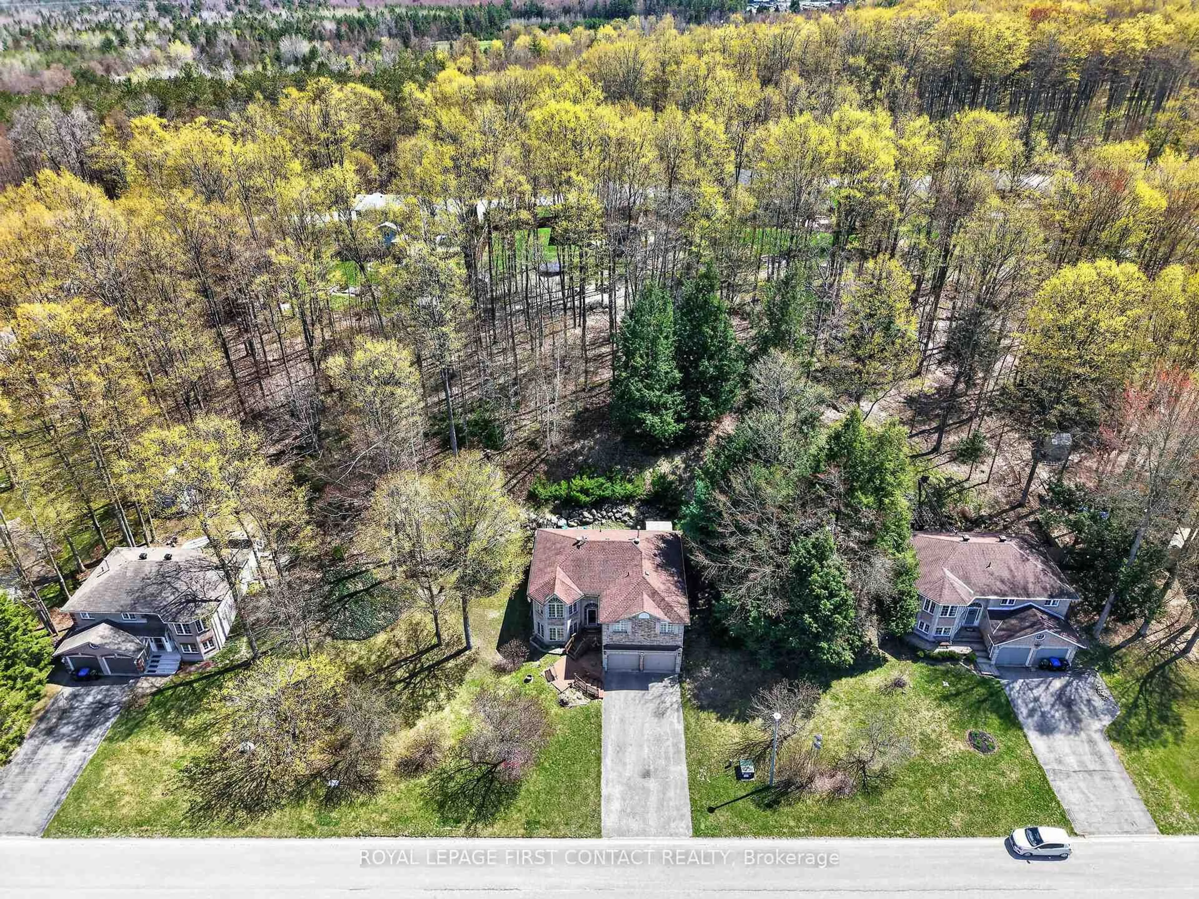 A pic from outside/outdoor area/front of a property/back of a property/a pic from drone, forest/trees view for 23 McFadden Dr, Springwater Ontario L0L 1V0