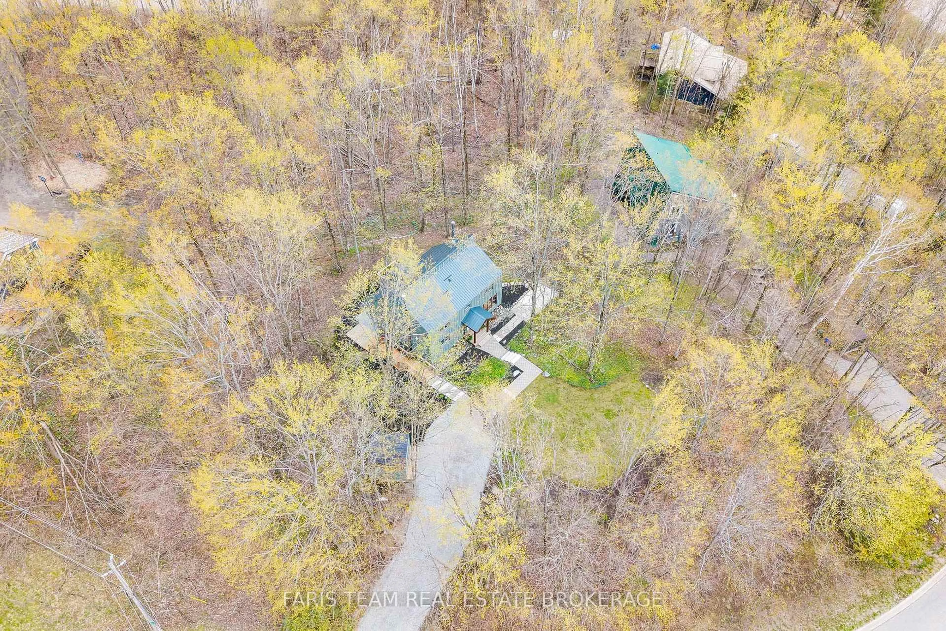 A pic from outside/outdoor area/front of a property/back of a property/a pic from drone, forest/trees view for 46 Huronwoods Dr, Oro-Medonte Ontario L0K 1E0