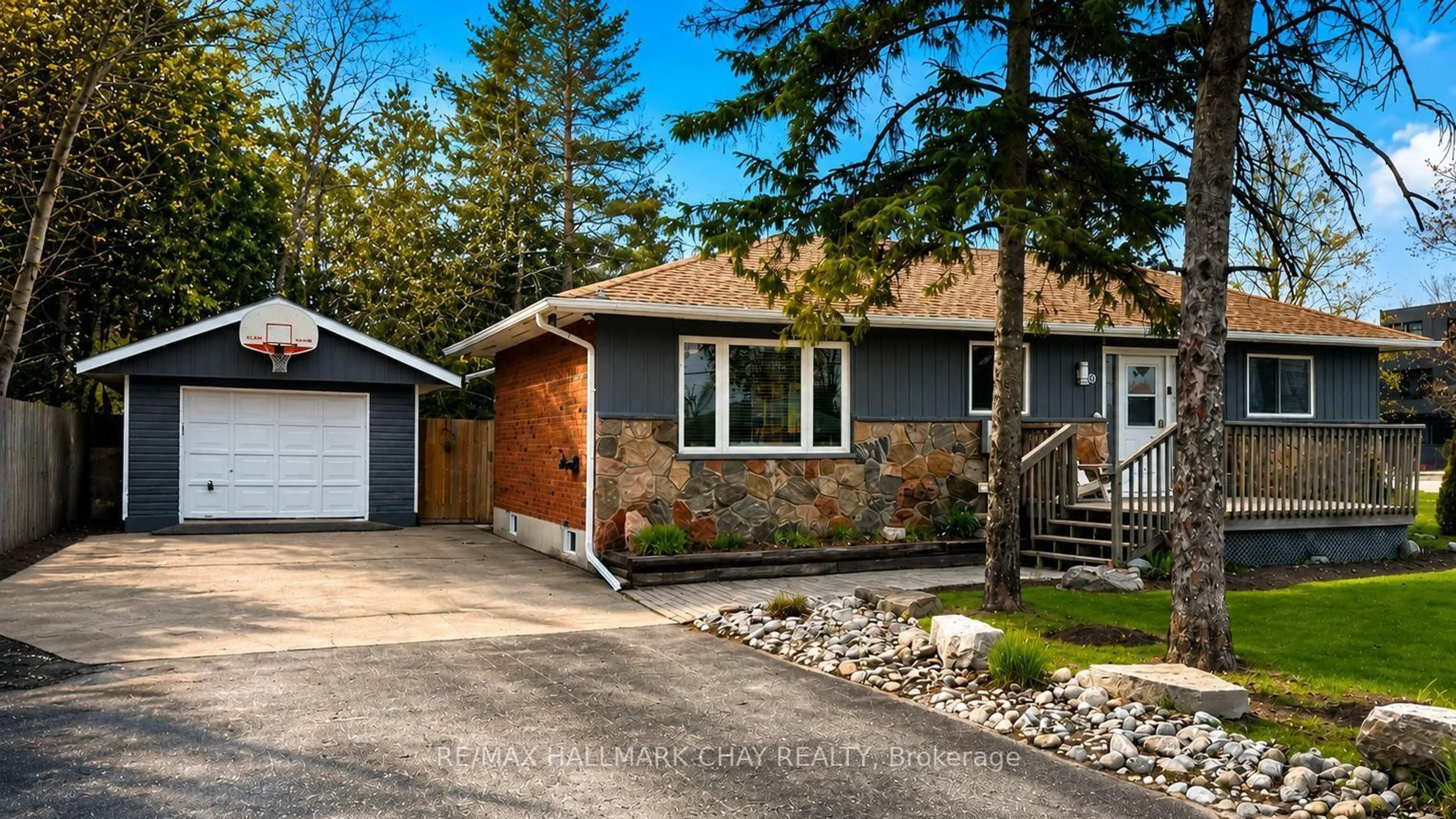 Home with vinyl exterior material, street for 10 Finlay Mill Rd, Springwater Ontario L0L 1X0