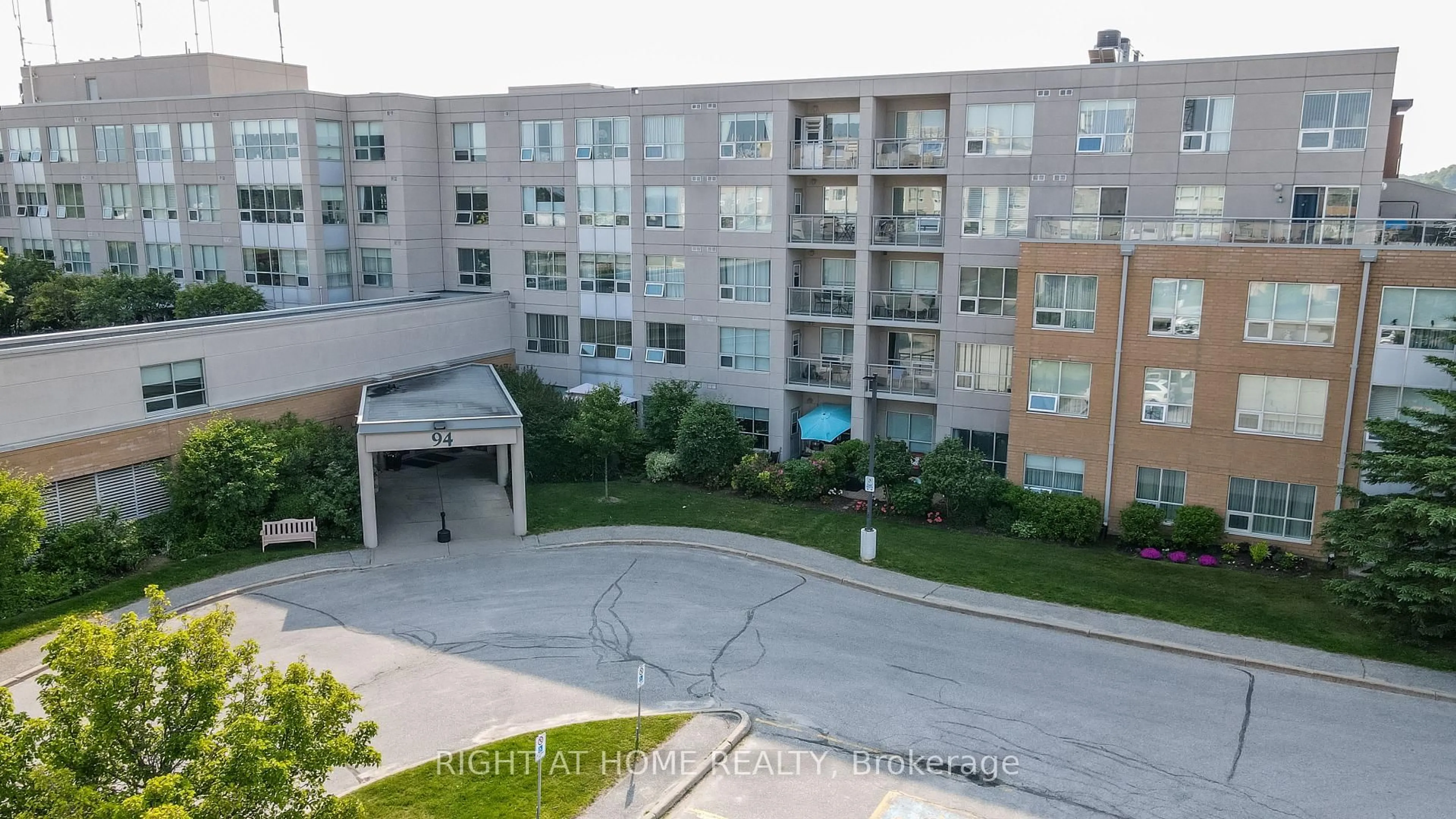 A pic from outside/outdoor area/front of a property/back of a property/a pic from drone, unknown for 94 Dean Ave #403, Barrie Ontario L4N 0M3