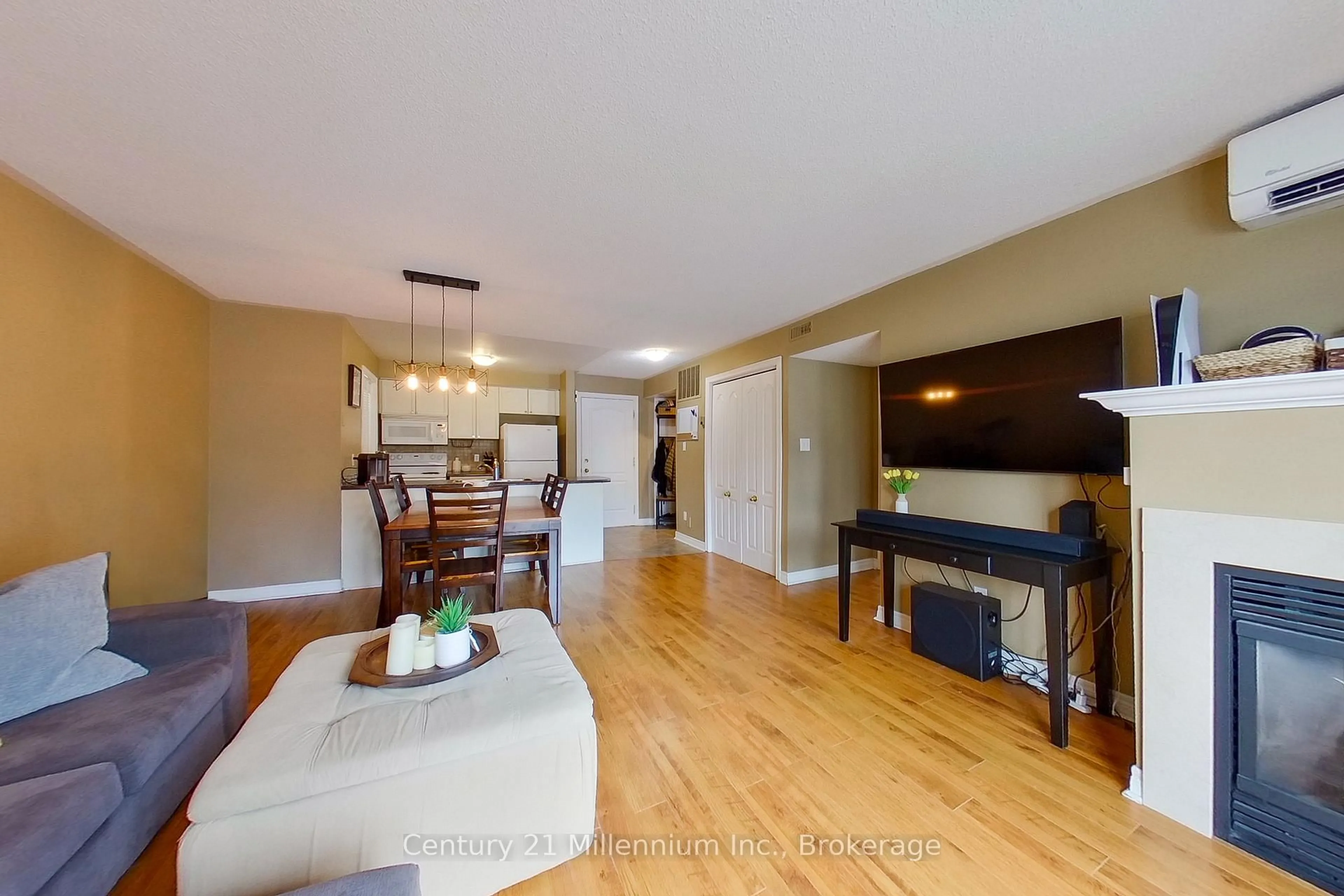 Living room with furniture, wood/laminate floor for 34 Dawson Dr #825, Collingwood Ontario L9Y 5B4