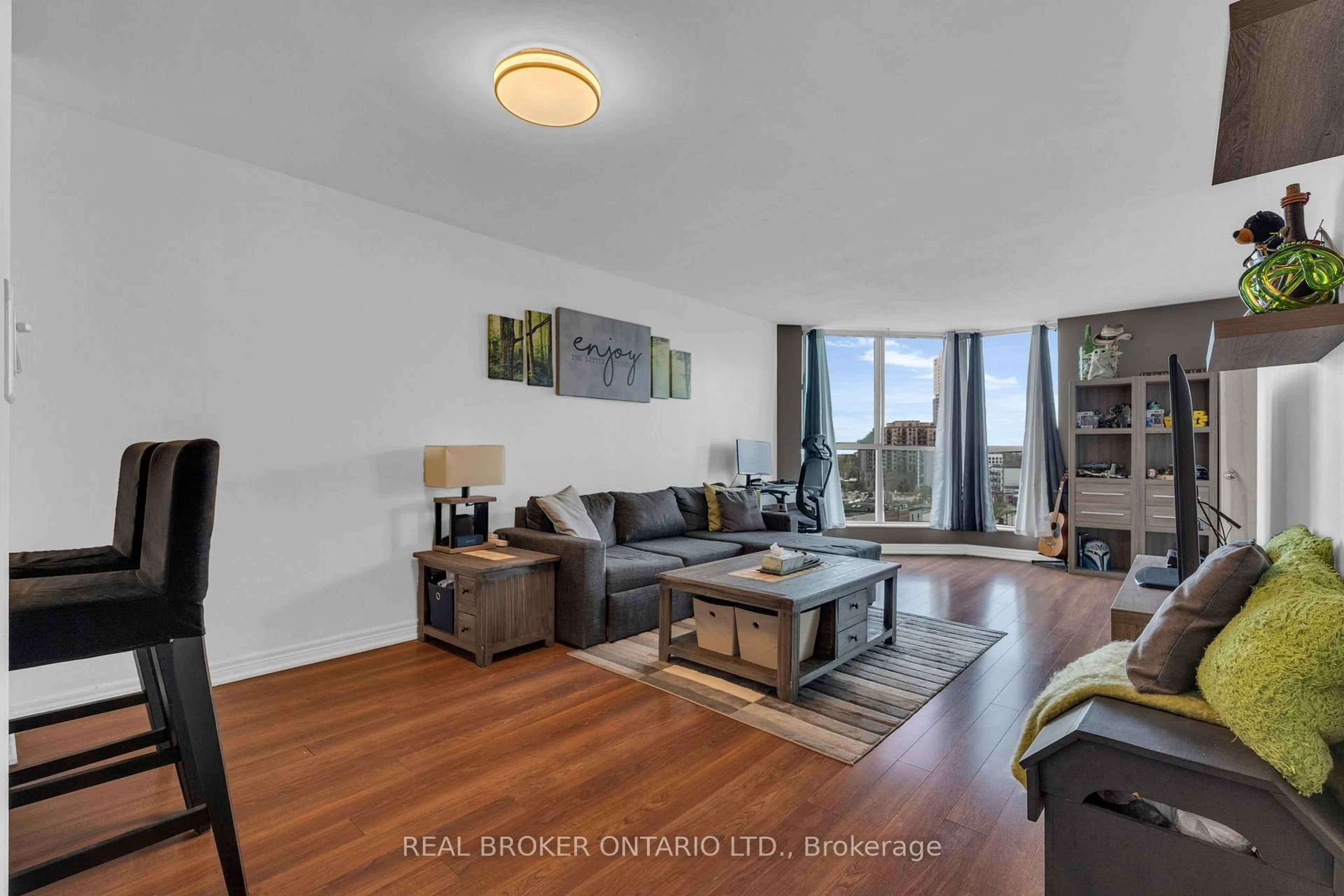 Living room with furniture, wood/laminate floor for 140 DUNLOP St #704, Barrie Ontario L4M 6H9