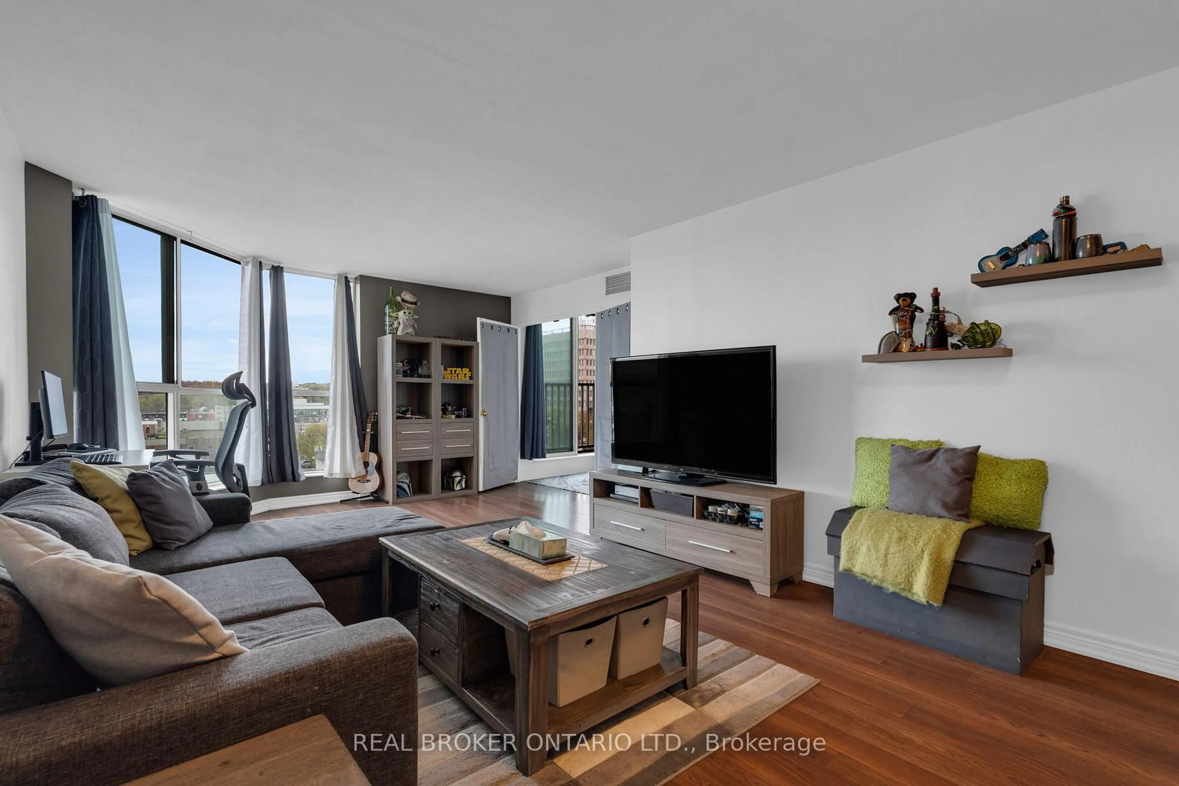 Living room with furniture, wood/laminate floor for 140 DUNLOP St #704, Barrie Ontario L4M 6H9