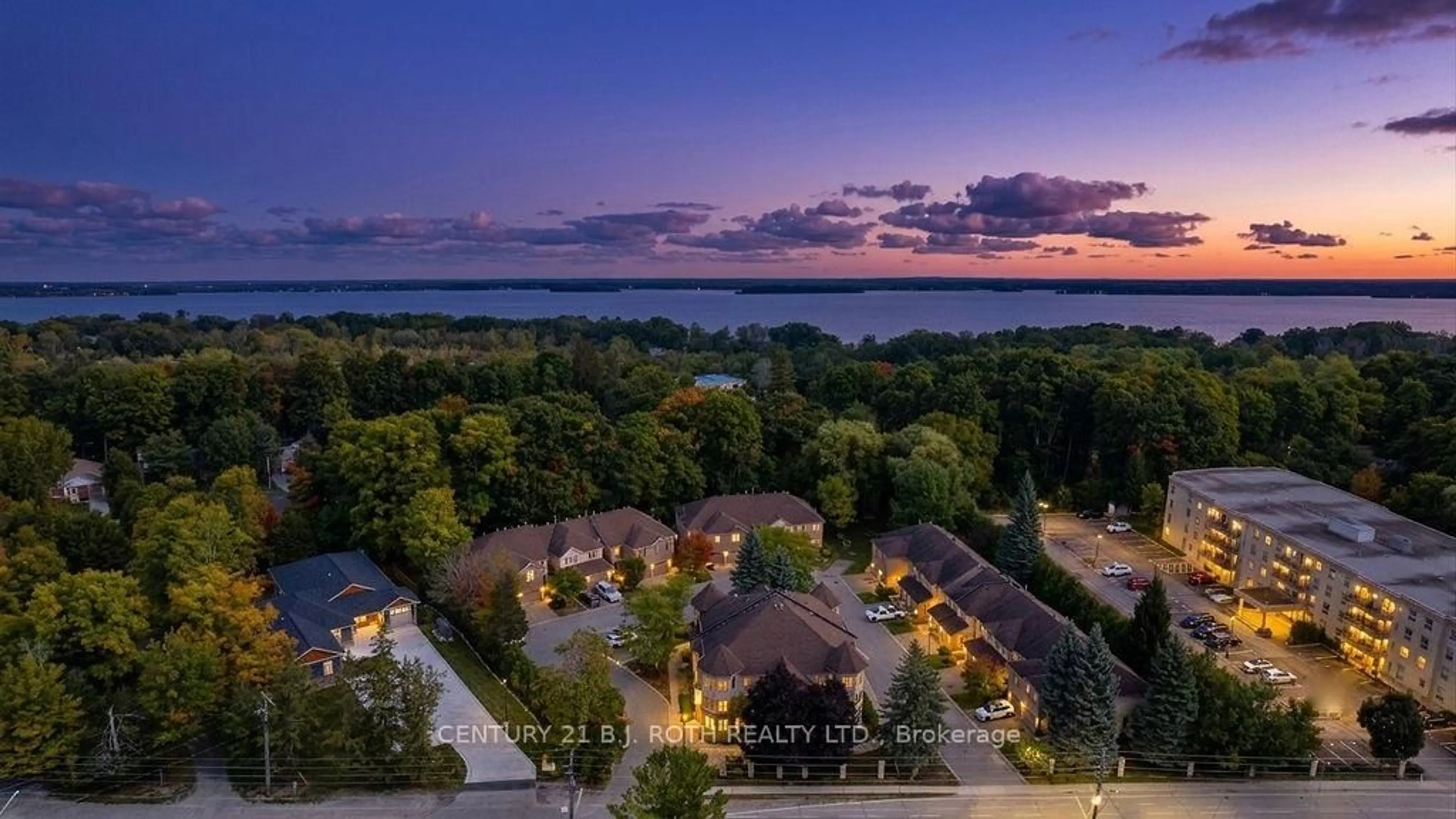 A pic from outside/outdoor area/front of a property/back of a property/a pic from drone, water/lake/river/ocean view for 492 Laclie St #10, Orillia Ontario L3V 7V2