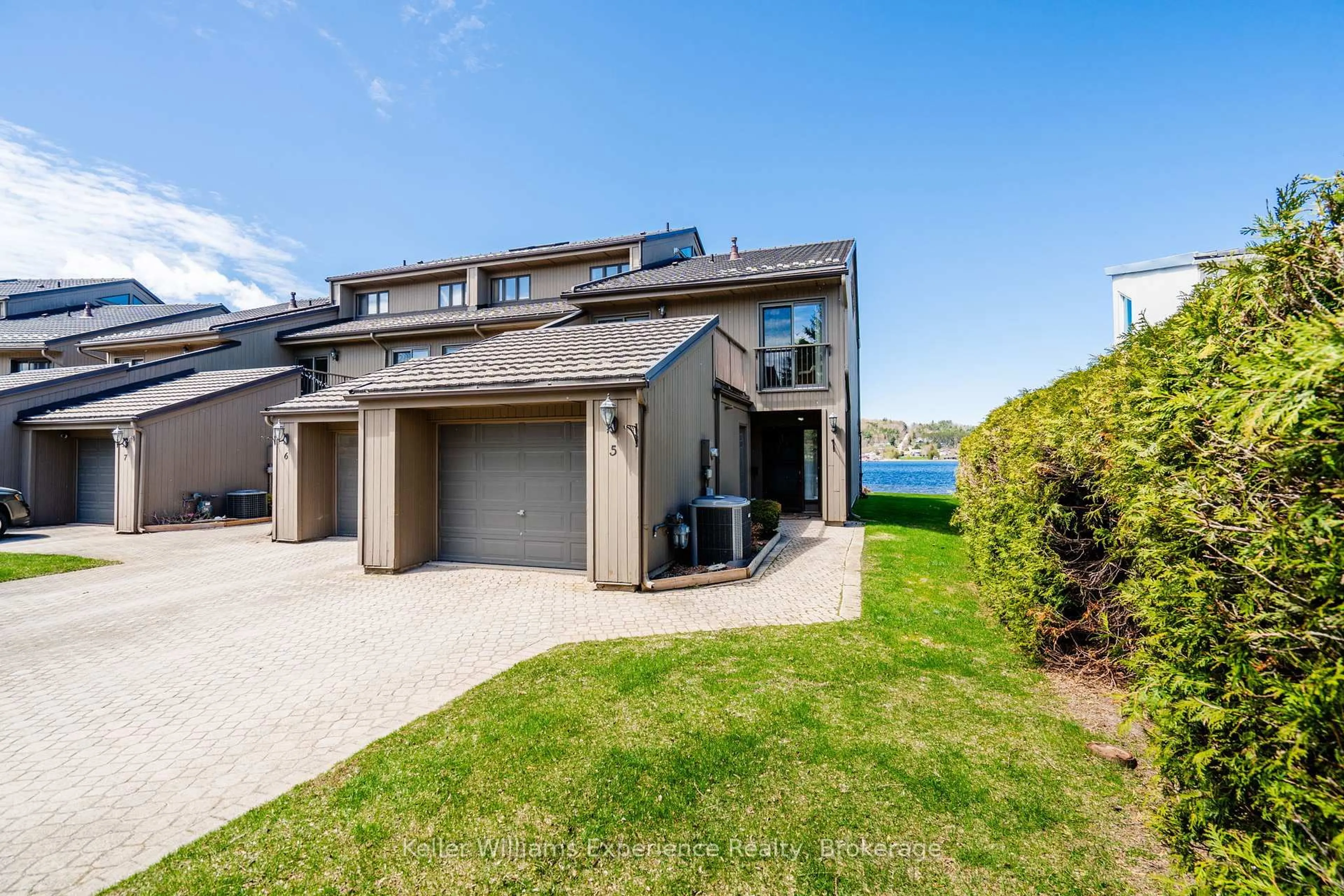 A pic from outside/outdoor area/front of a property/back of a property/a pic from drone, water/lake/river/ocean view for 8 Beck Blvd #5, Penetanguishene Ontario L9M 1C3