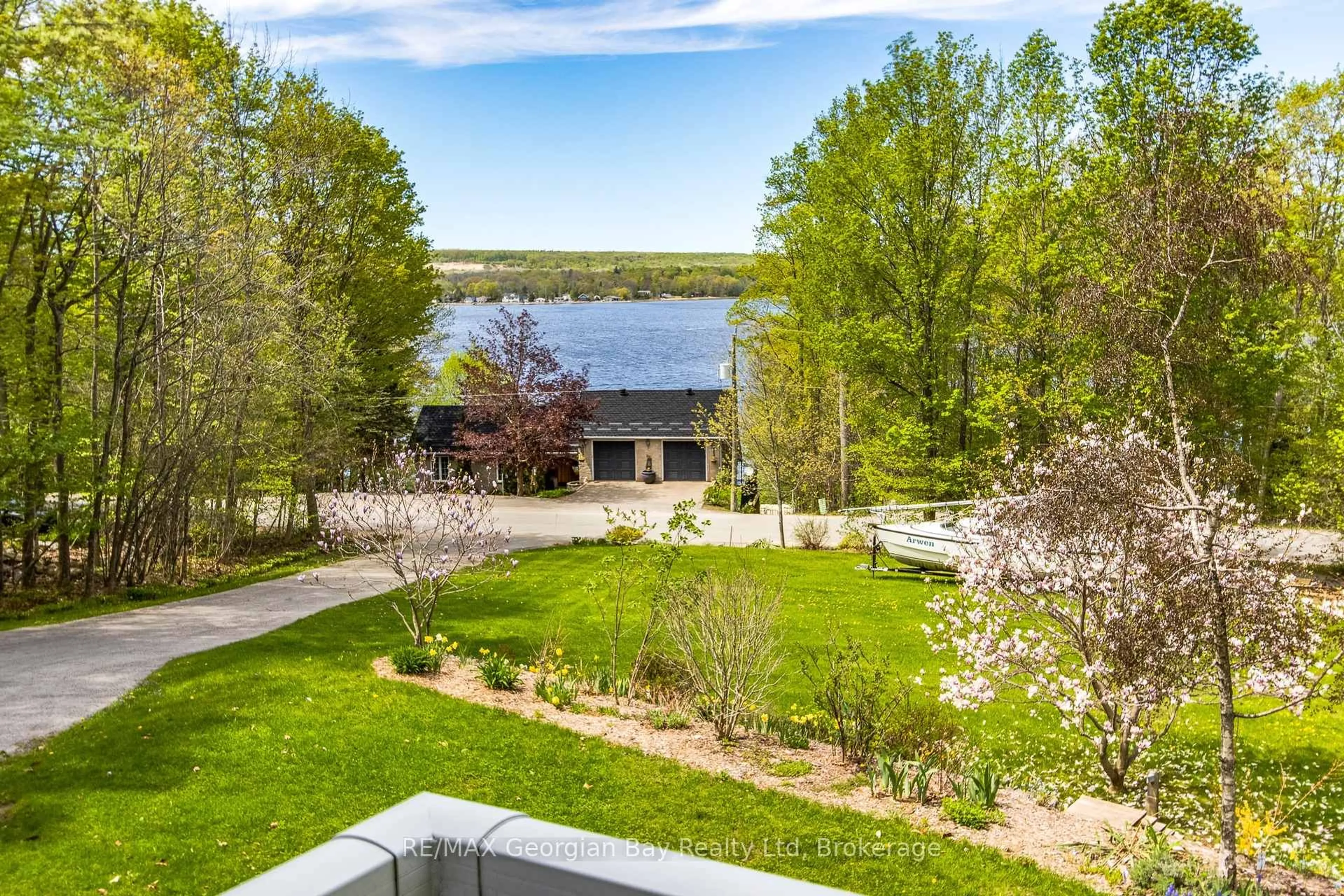 A pic from outside/outdoor area/front of a property/back of a property/a pic from drone, water/lake/river/ocean view for 125 Gilwood Park Dr, Penetanguishene Ontario L9M 1Z1