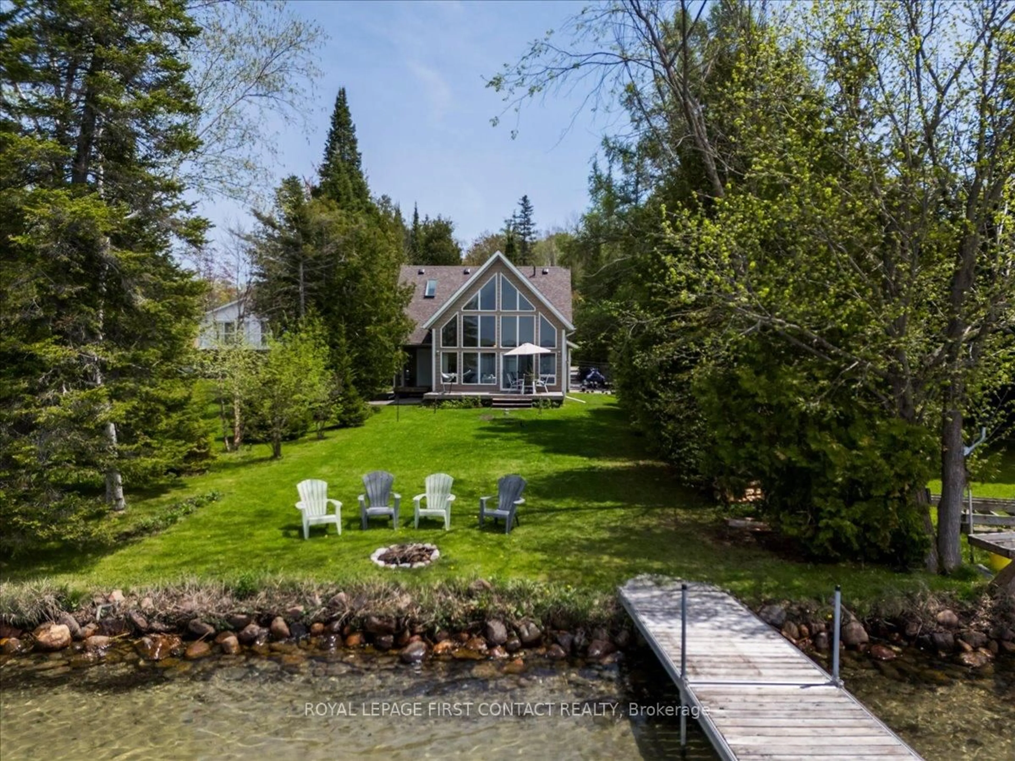 A pic from outside/outdoor area/front of a property/back of a property/a pic from drone, water/lake/river/ocean view for 10 Buttercup Lane, Springwater Ontario L0L 1P0