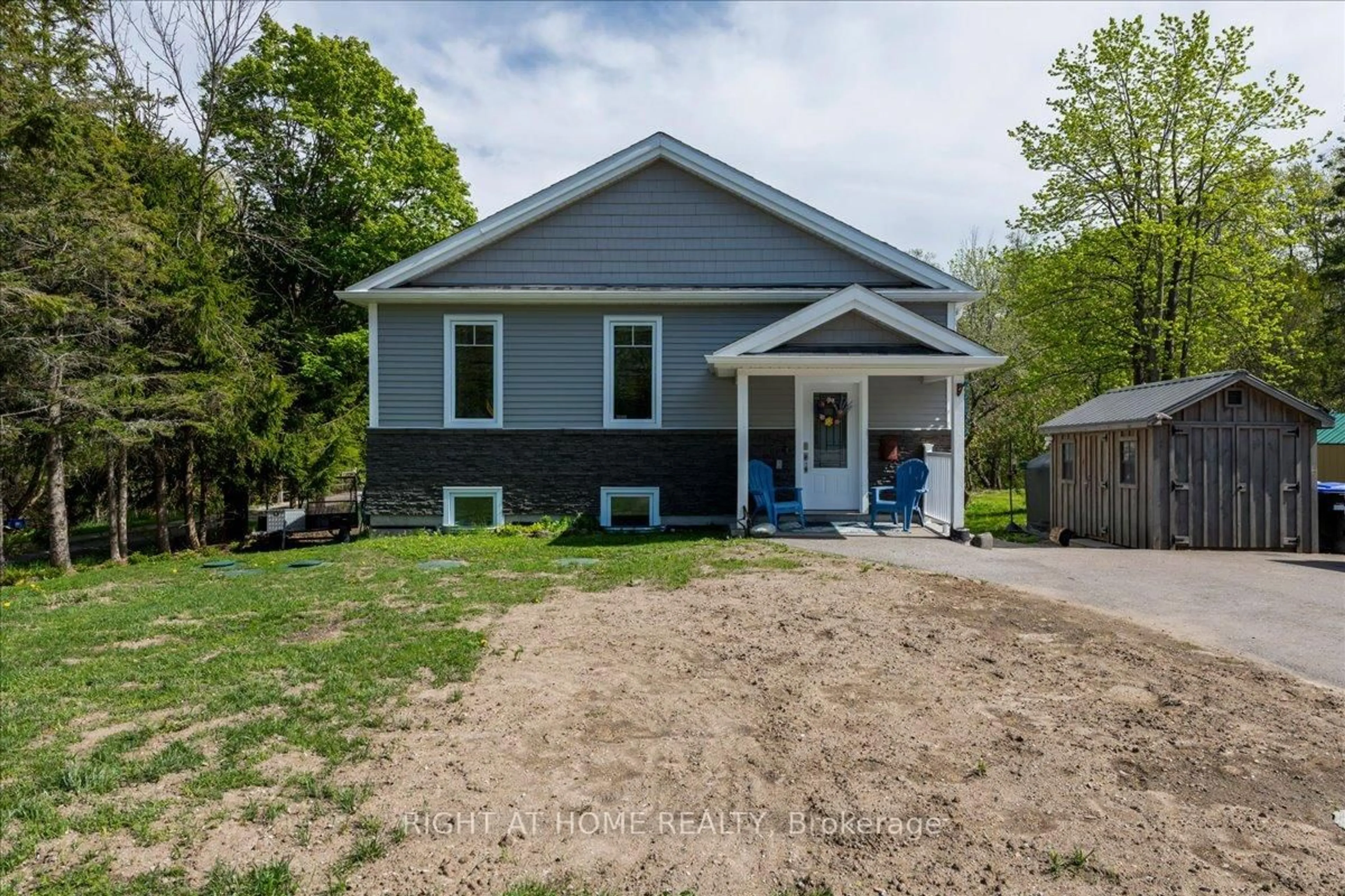 Home with vinyl exterior material, street for 15204 Highway 12 Highway, Tay Ontario L0K 2A0