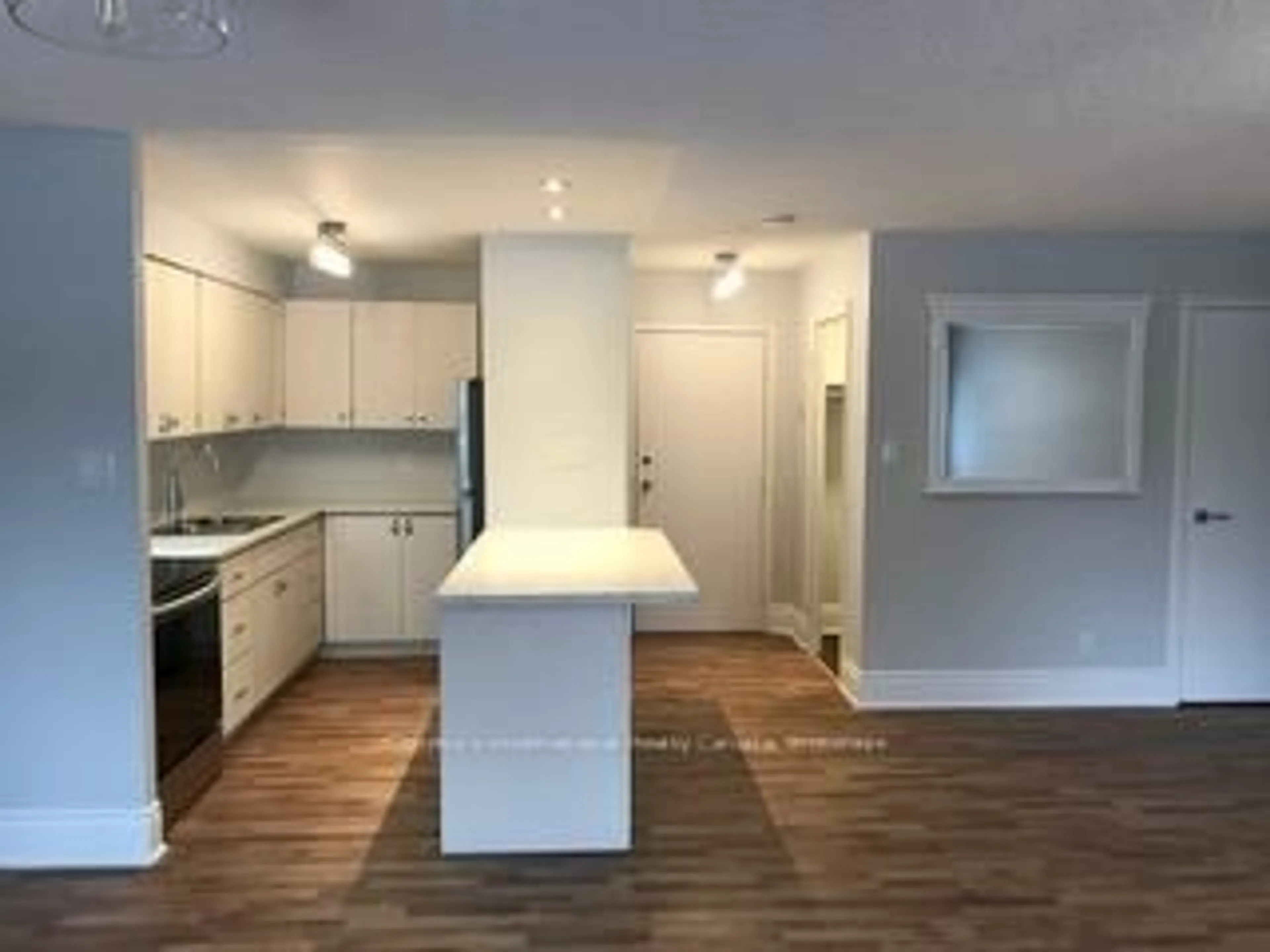 Open concept kitchen, wood/laminate floor for 173 EIGHTH St #101, Collingwood Ontario L9Y 2C9
