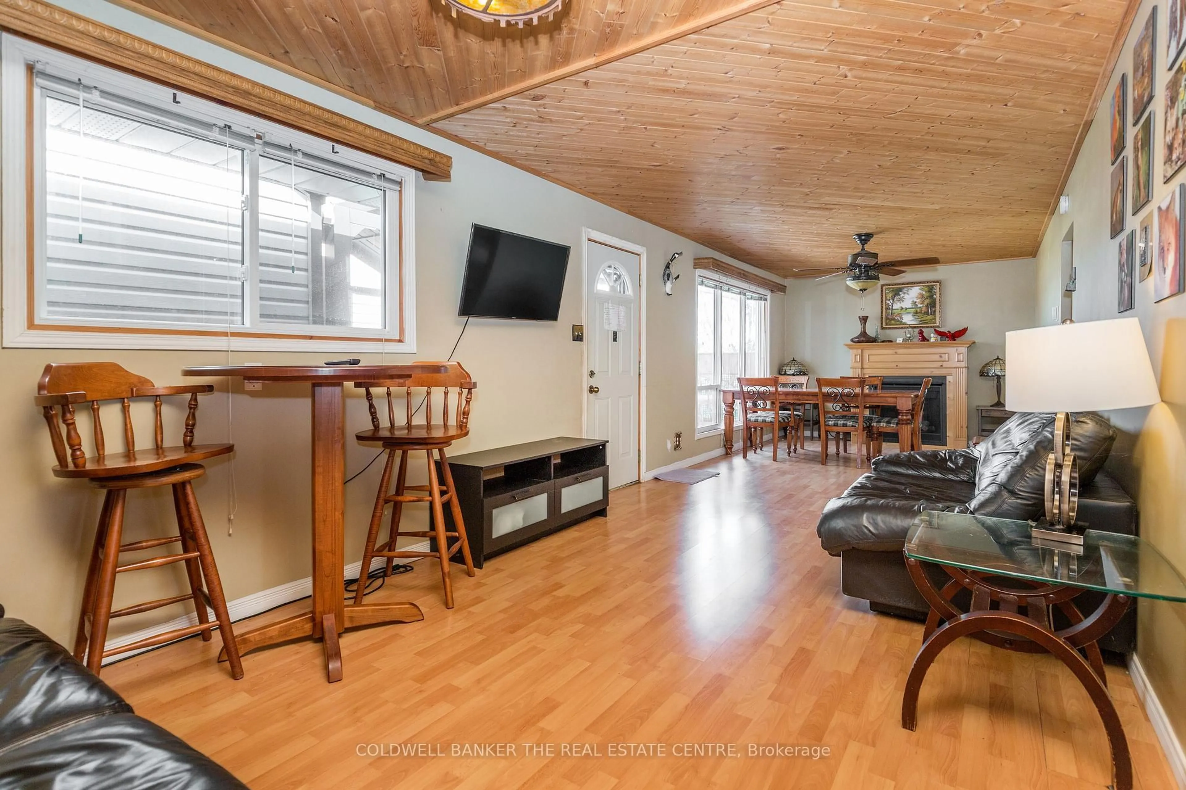 Living room with furniture, wood/laminate floor for 121 Maskinonge Rd, Tay Ontario L0K 2A0