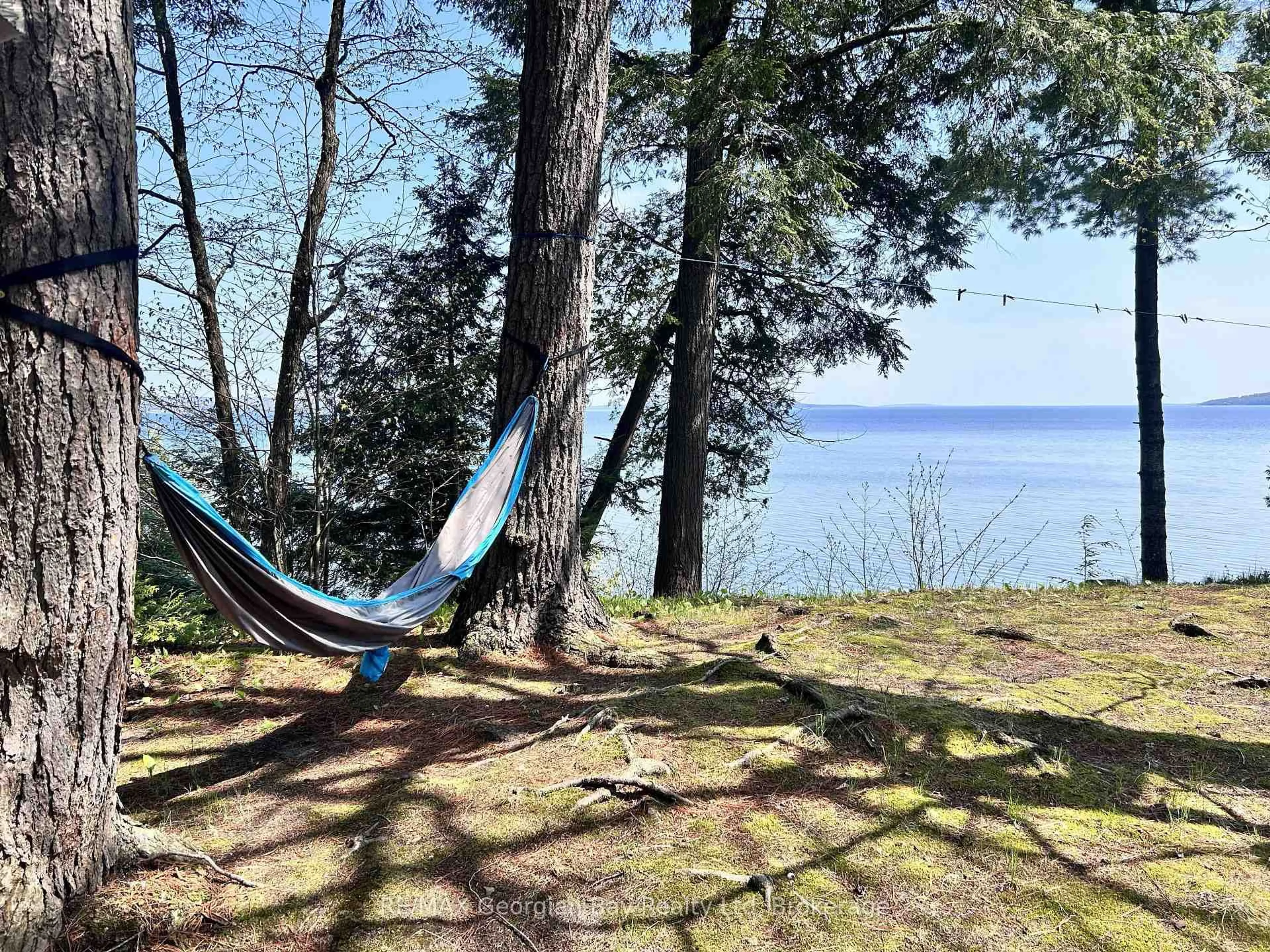Patio, water/lake/river/ocean view for 589 Mkade Kegwin Miikan Rd, Christian Island 30 Ontario L9M 0A9
