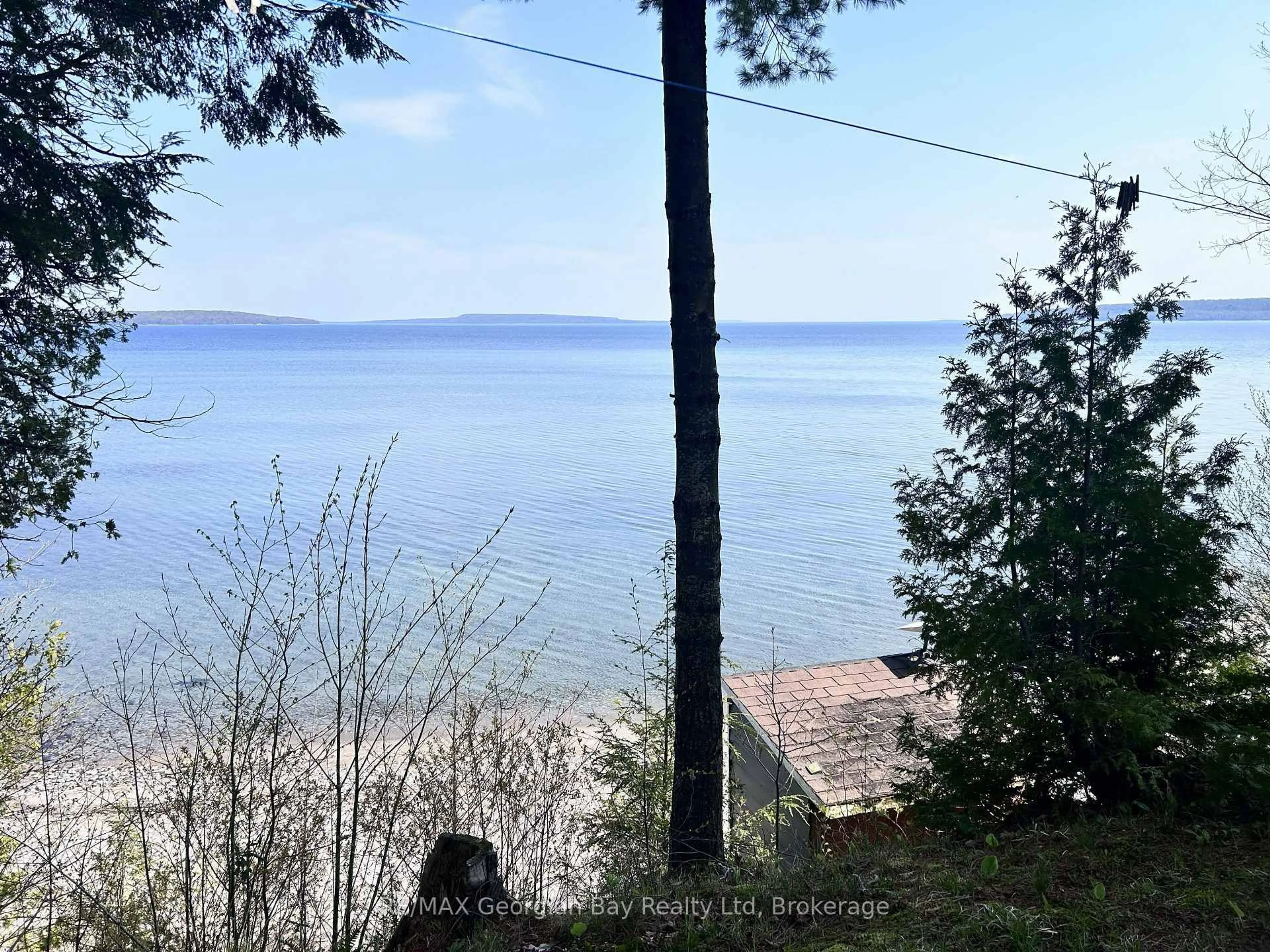 A pic from outside/outdoor area/front of a property/back of a property/a pic from drone, water/lake/river/ocean view for 589 Mkade Kegwin Miikan Rd, Christian Island 30 Ontario L9M 0A9