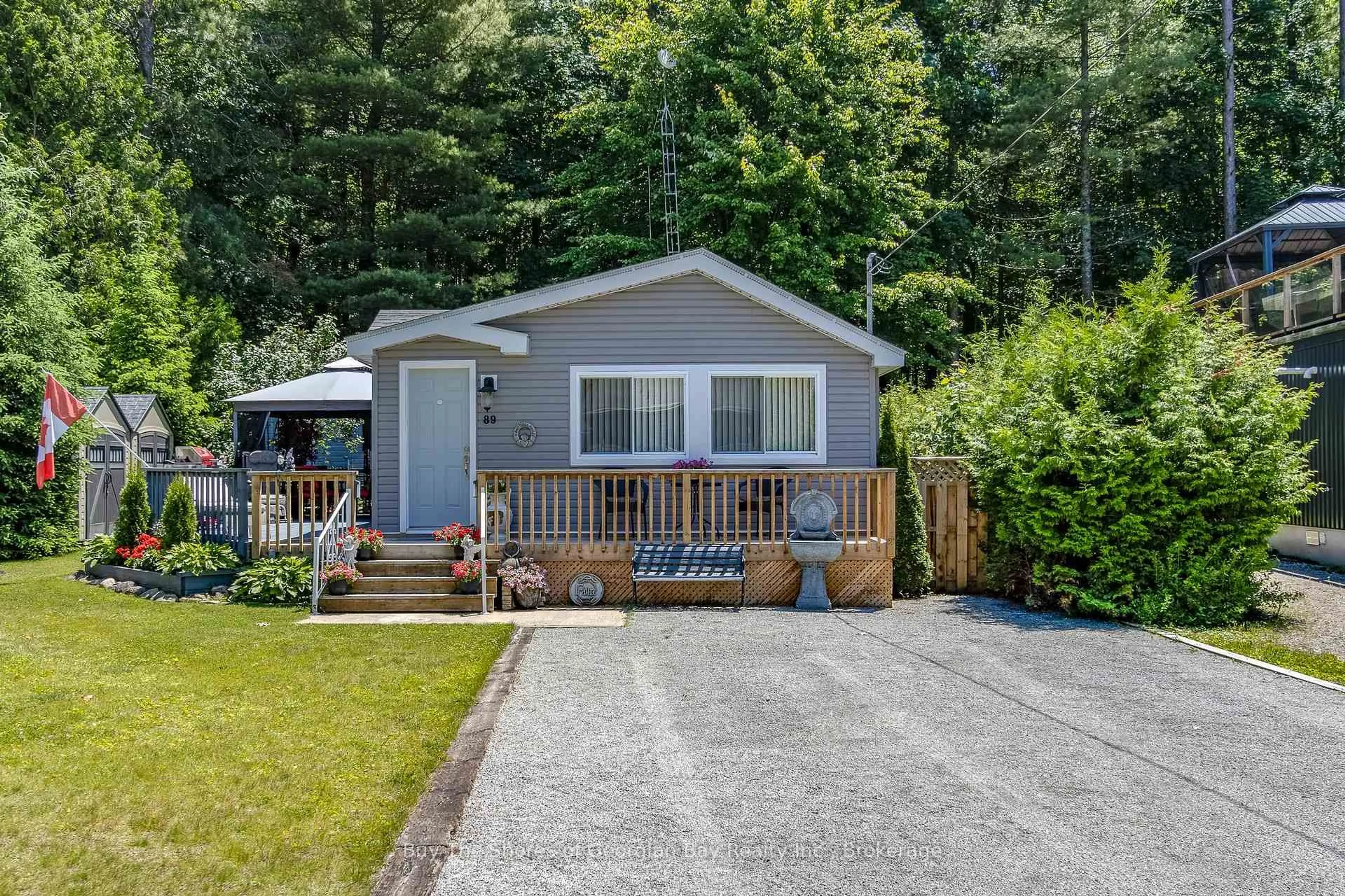 Home with vinyl exterior material, street for 89 Andrew Dr, Tiny Ontario L9M 0B4