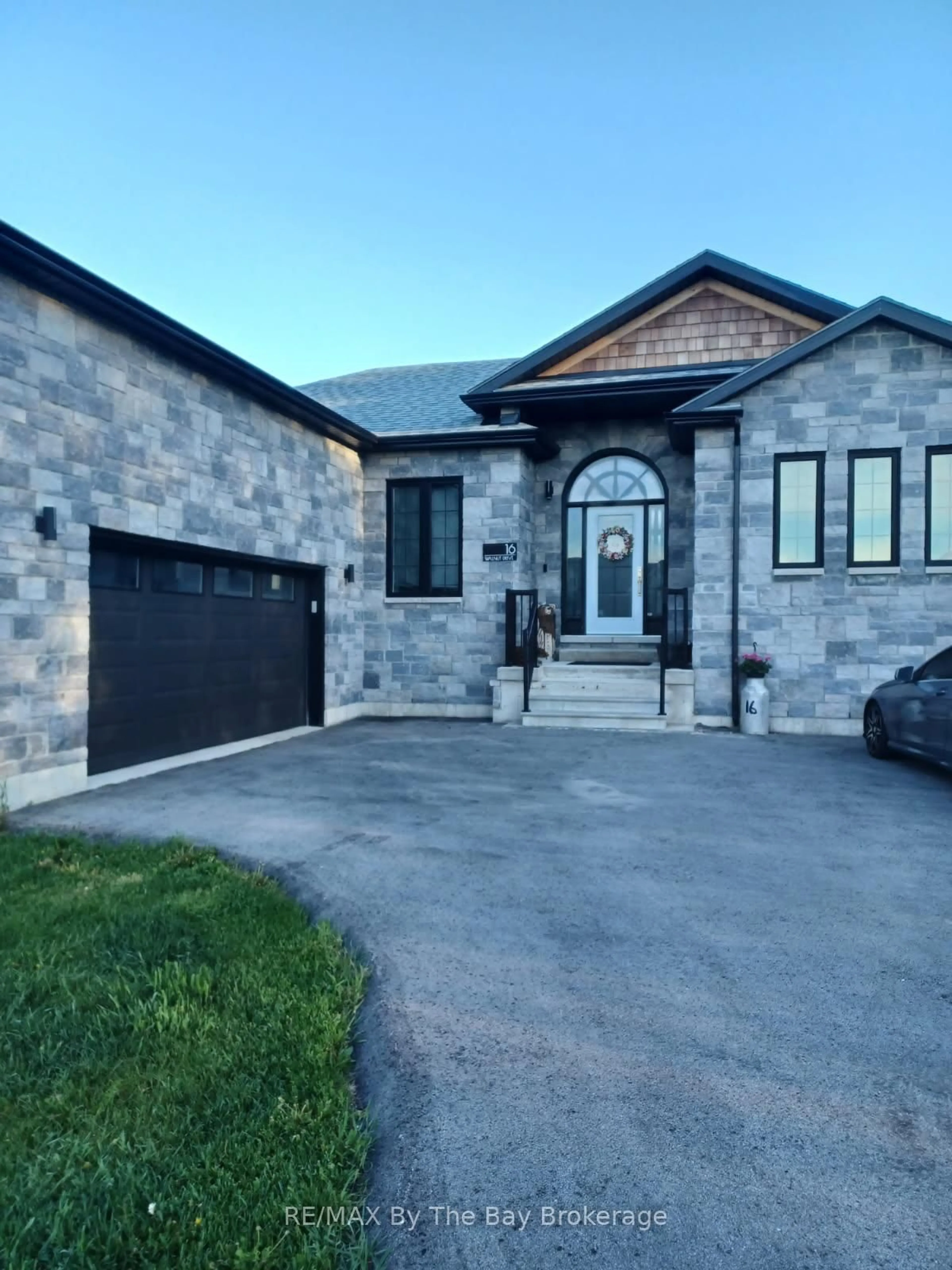 Home with brick exterior material, street for 16 Walnut Dr, Wasaga Beach Ontario L9Z 0A9