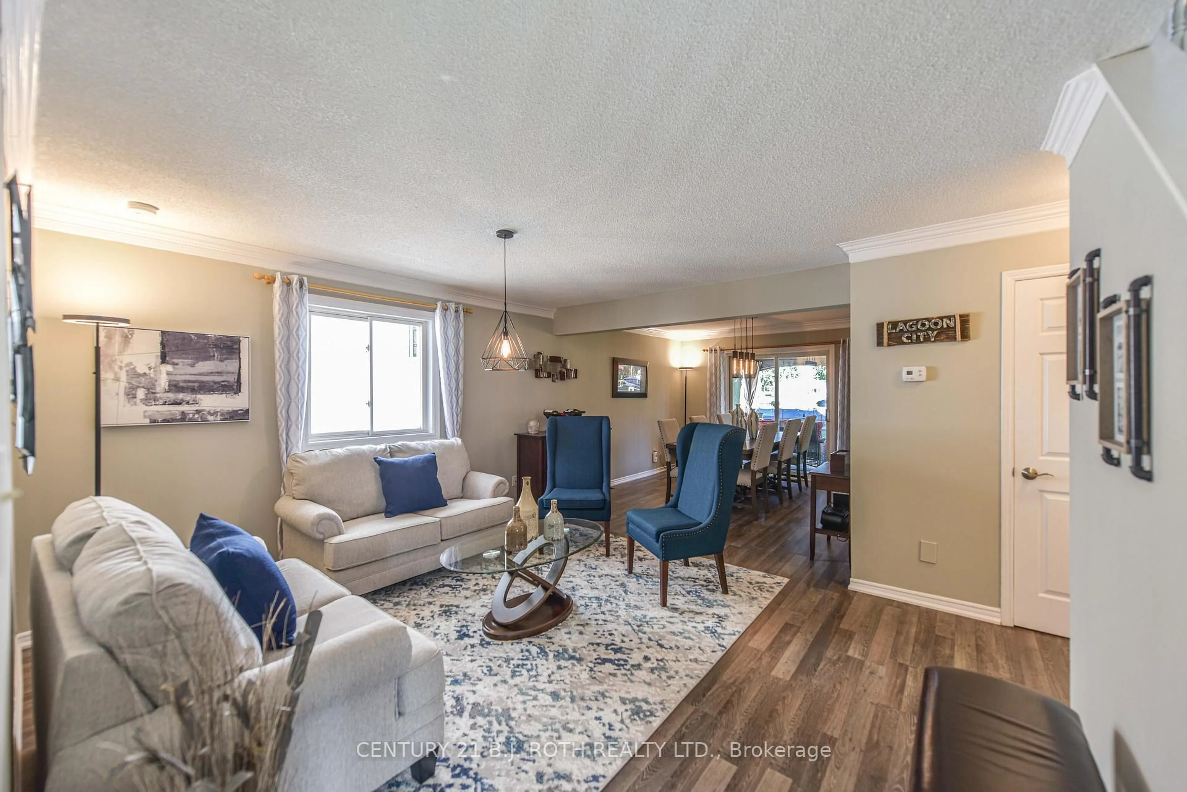 Living room with furniture, wood/laminate floor for 60 Simcoe Rd, Ramara Ontario L0K 1B0