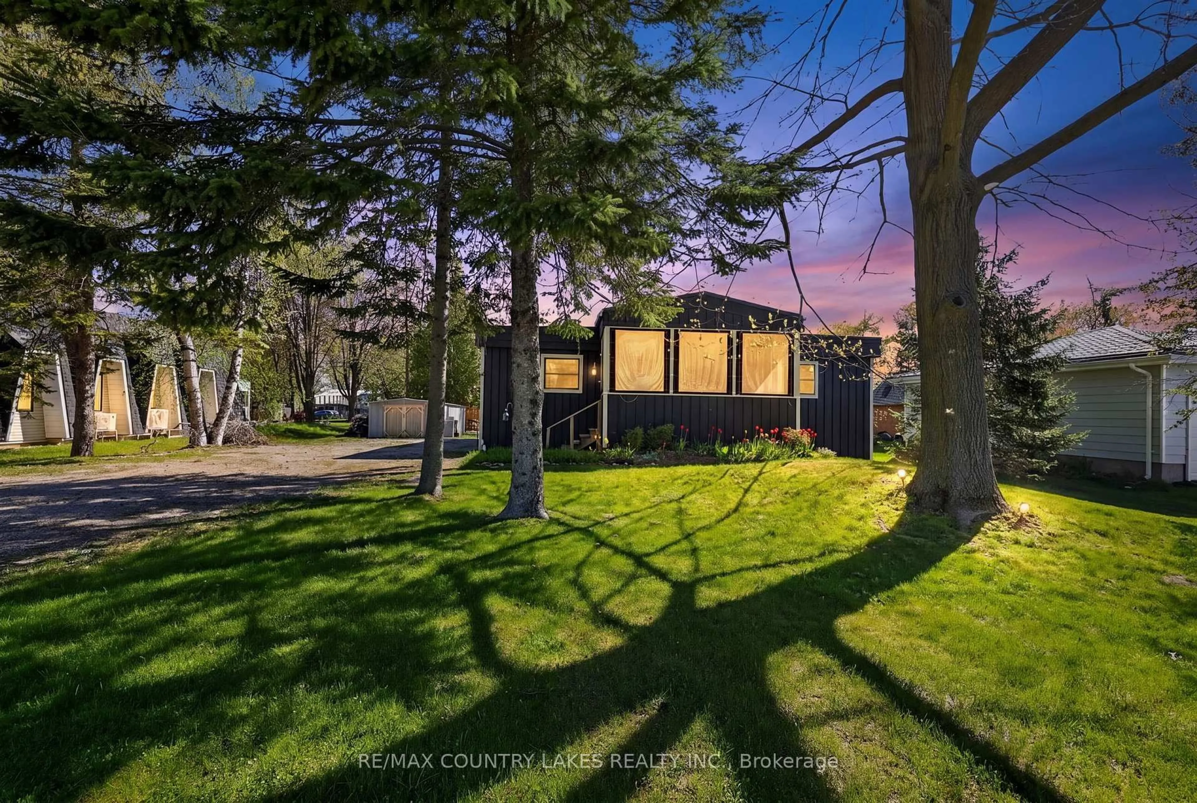 A pic from outside/outdoor area/front of a property/back of a property/a pic from drone, forest/trees view for 19 Poplar Cres, Ramara Ontario L0K 1B0
