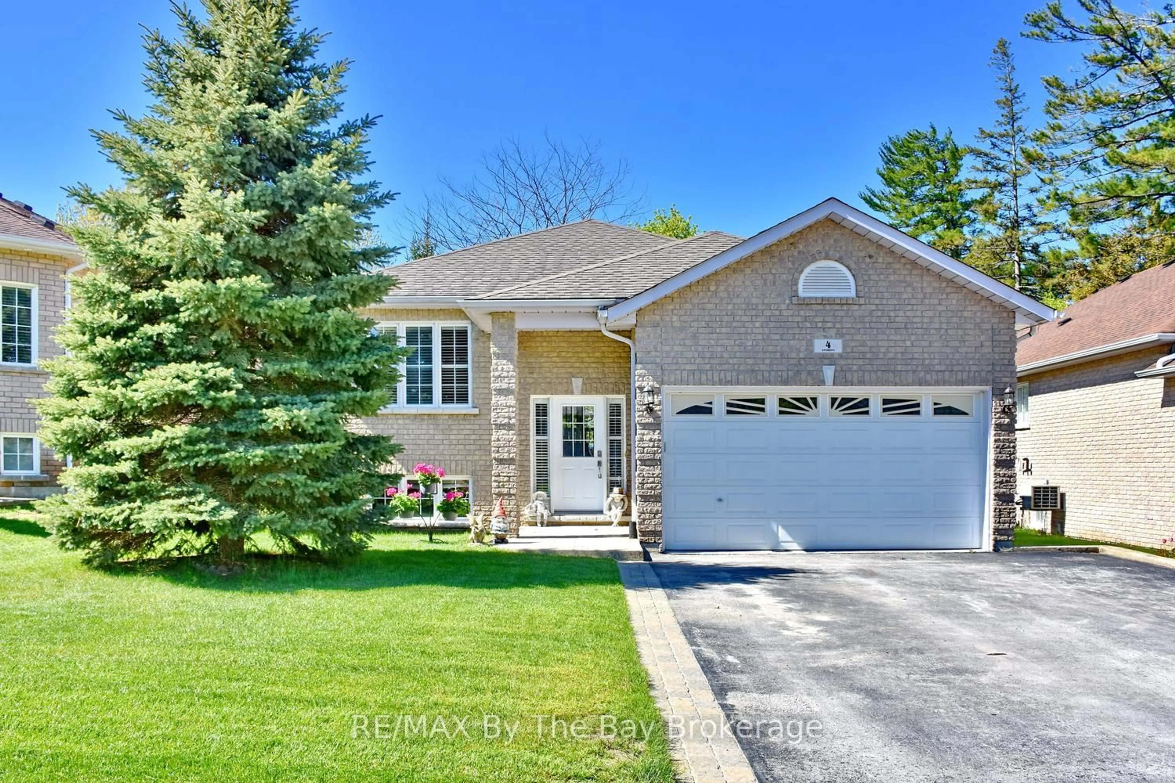 Home with brick exterior material, street for 4 Anthony St, Wasaga Beach Ontario L9Z 2N4