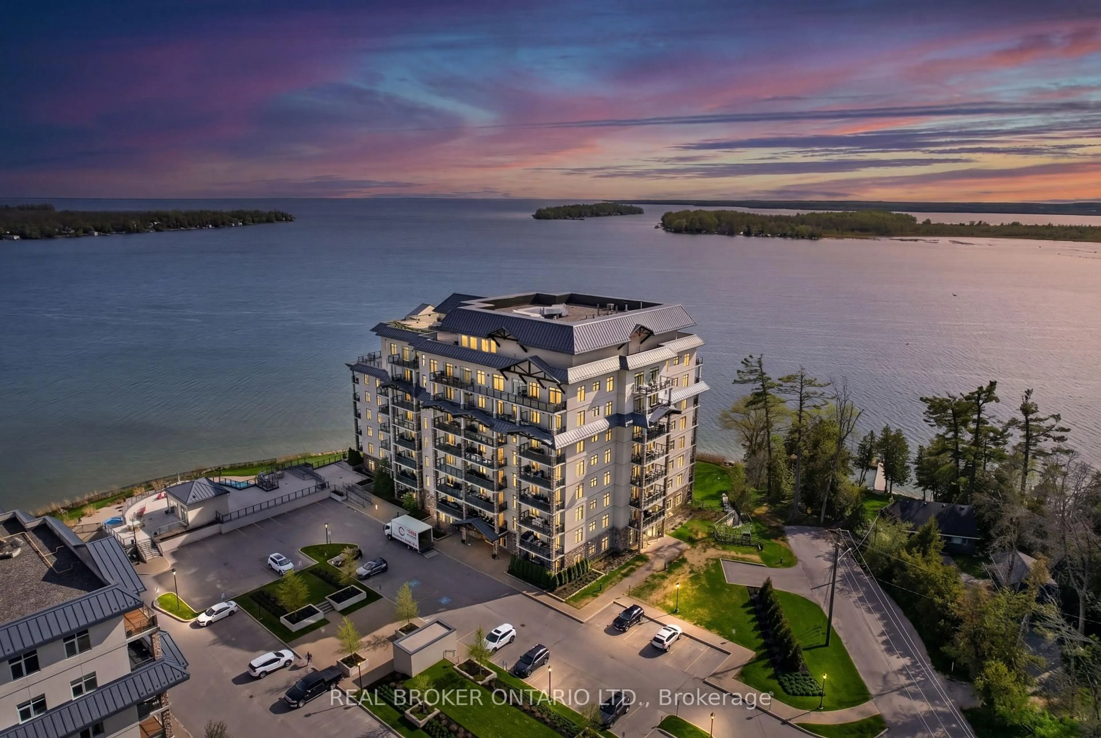 A pic from outside/outdoor area/front of a property/back of a property/a pic from drone, water/lake/river/ocean view for 90 Orchard Point Rd #207, Orillia Ontario L3V 8K4