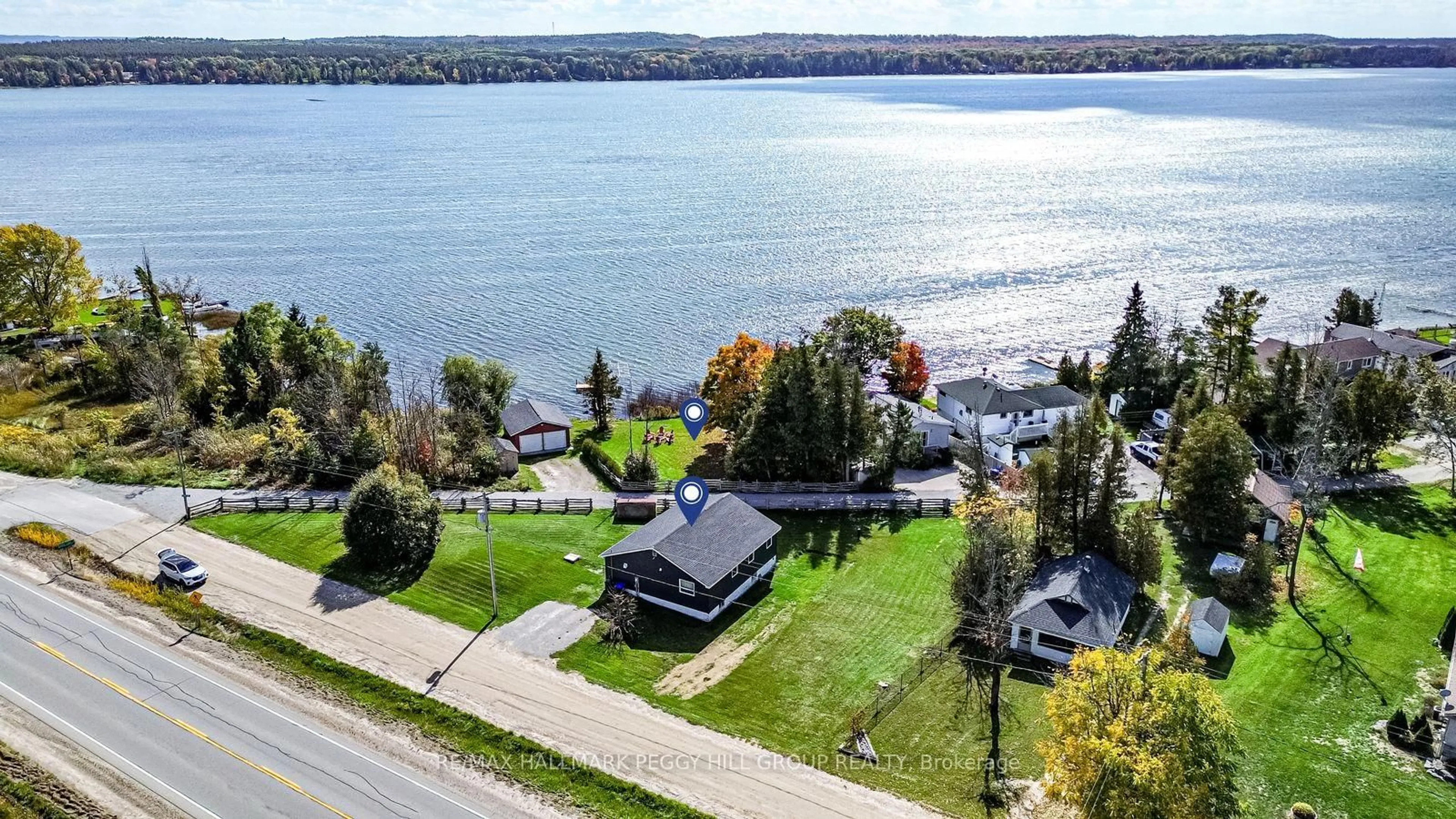 A pic from outside/outdoor area/front of a property/back of a property/a pic from drone, water/lake/river/ocean view for 5724 & 1 Penetanguishene Road & Cedar Lane, Springwater Ontario L0L 1P0