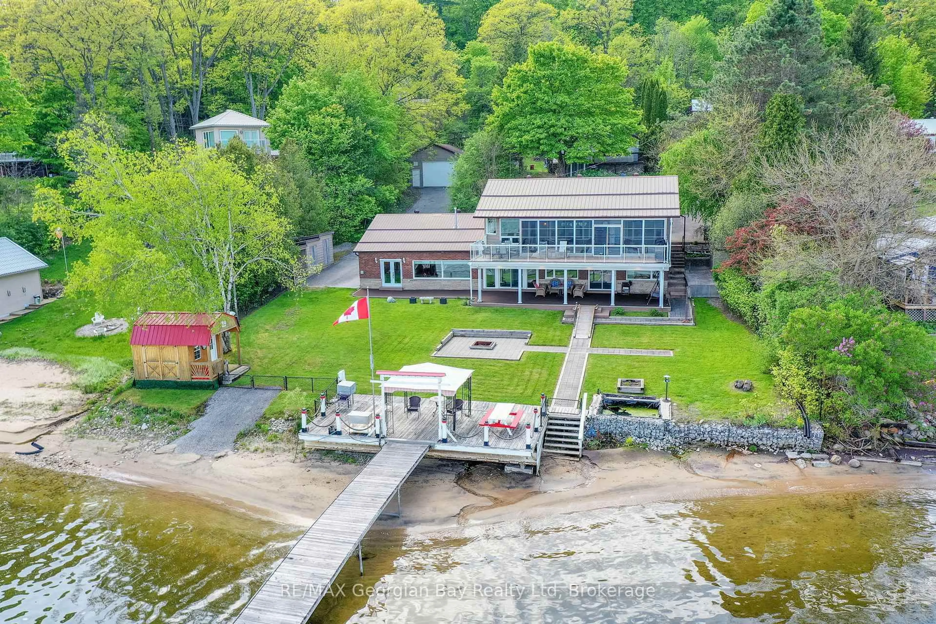 A pic from outside/outdoor area/front of a property/back of a property/a pic from drone, water/lake/river/ocean view for 405 Champlain Rd, Penetanguishene Ontario L9M 1S3