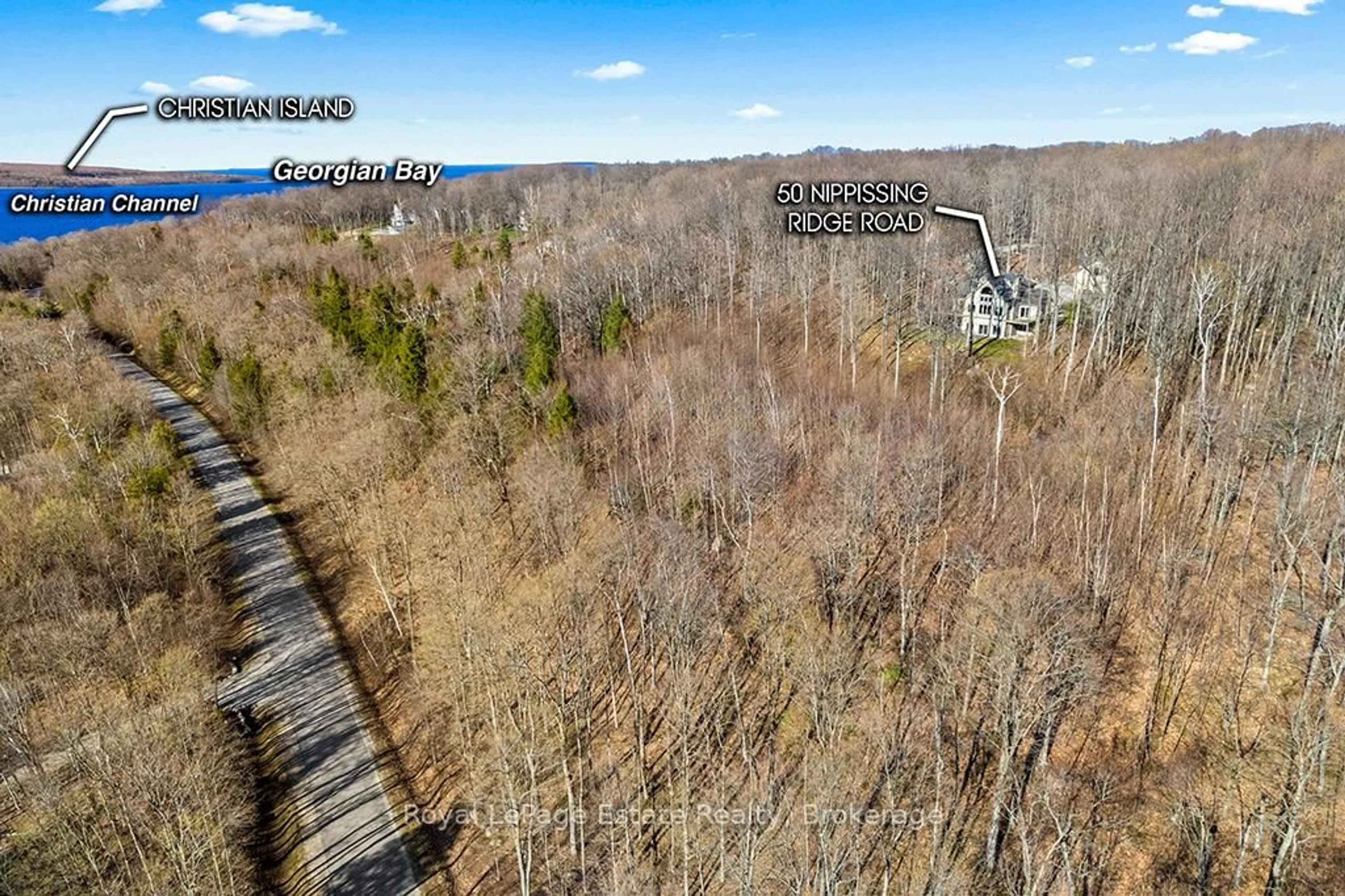 A pic from outside/outdoor area/front of a property/back of a property/a pic from drone, forest/trees view for 50 Nippissing Ridge Rd, Tiny Ontario L9Y 0T8