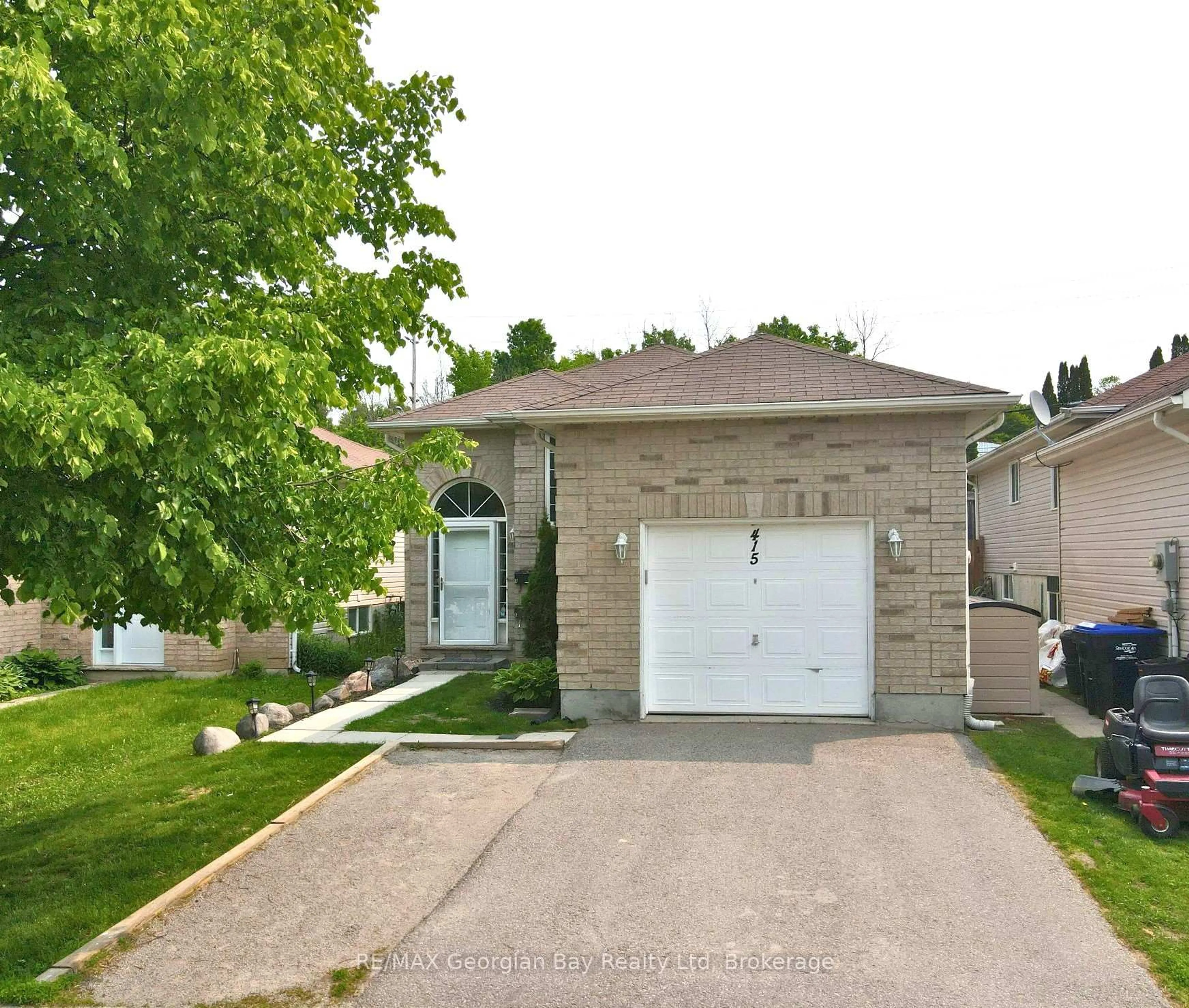 Home with brick exterior material, street for 415 Irwin St, Midland Ontario L4R 2V6