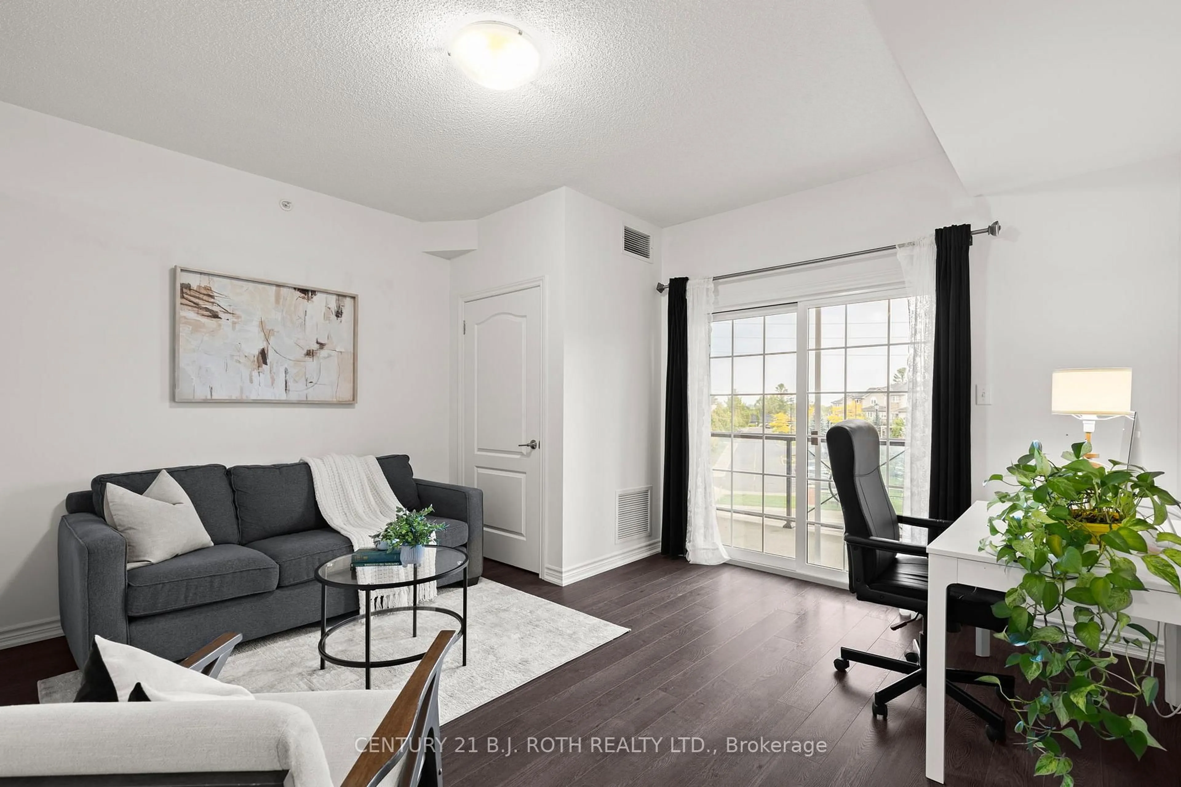 Living room with furniture, wood/laminate floor for 40 FERNDALE Dr #204, Barrie Ontario L4N 2L3