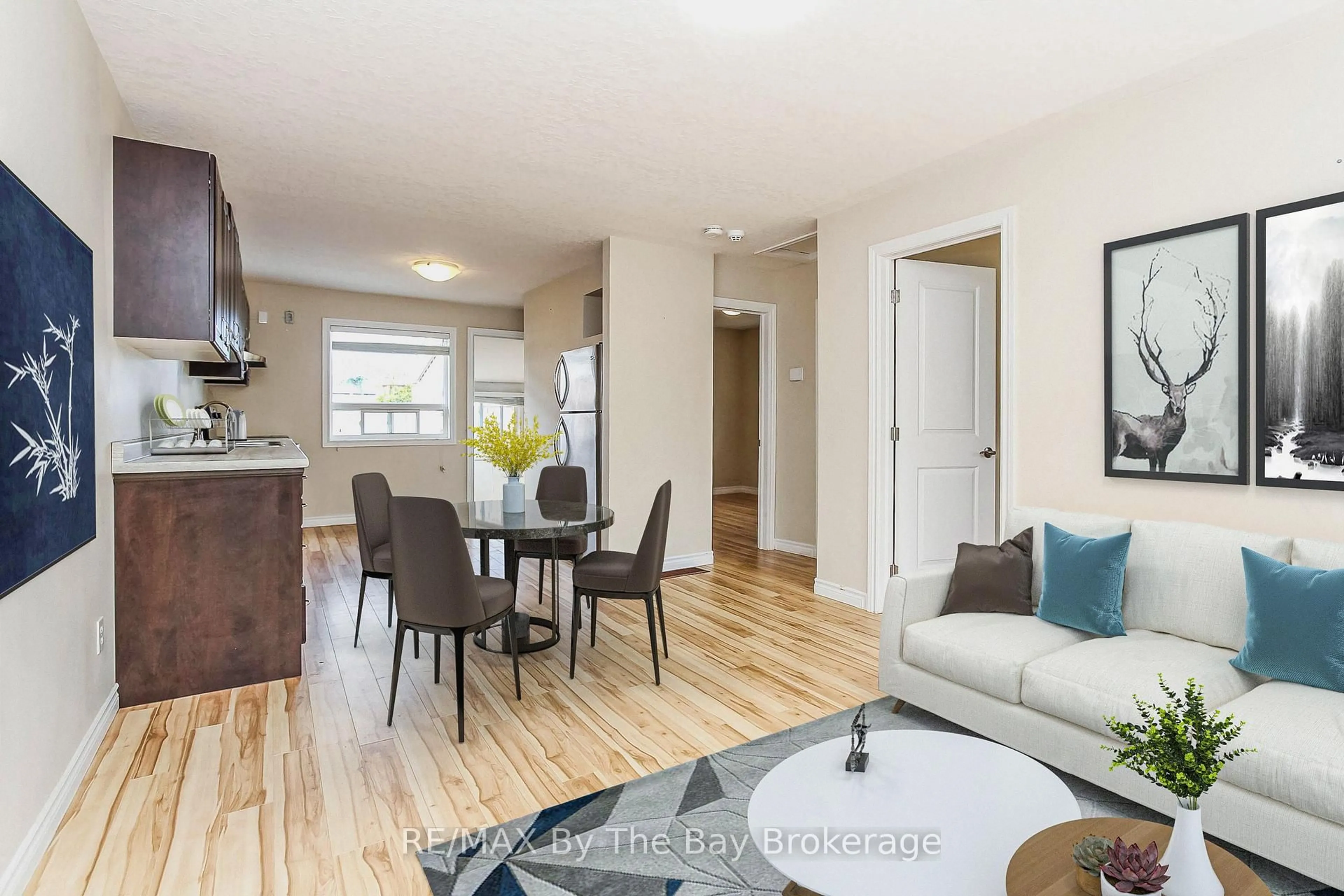 Living room with furniture, wood/laminate floor for 24 Glenwood Dr, Wasaga Beach Ontario L9Z 2K5