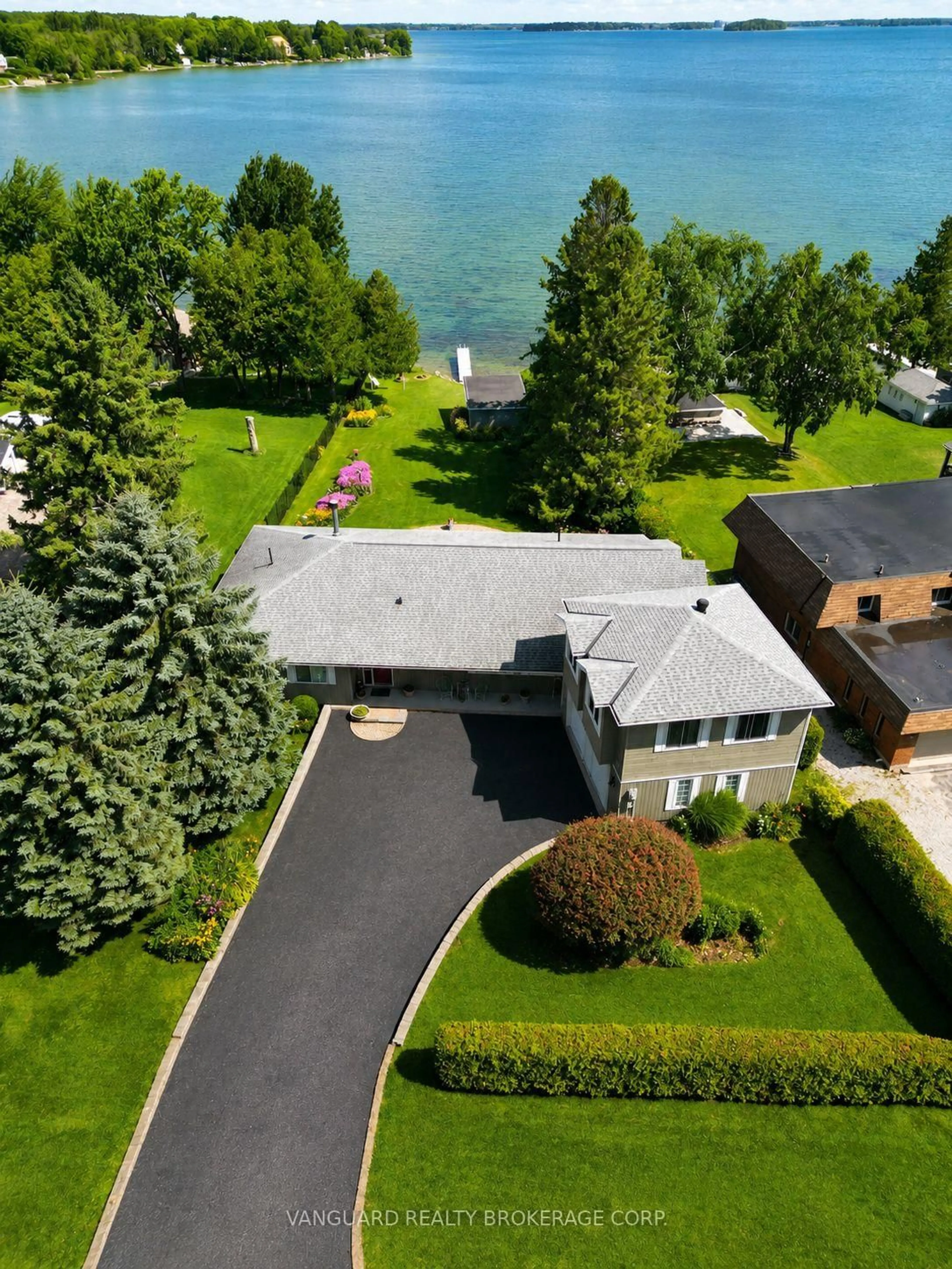 A pic from outside/outdoor area/front of a property/back of a property/a pic from drone, water/lake/river/ocean view for 835 Woodland Dr, Oro-Medonte Ontario L3V 6H1
