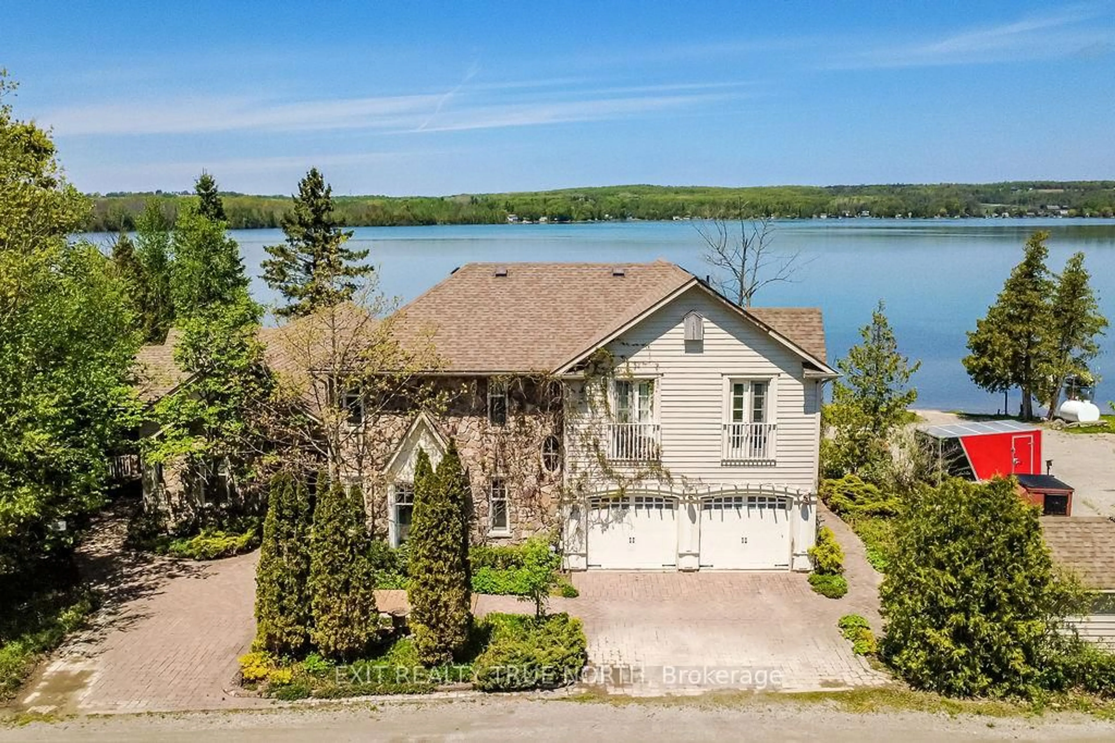 A pic from outside/outdoor area/front of a property/back of a property/a pic from drone, water/lake/river/ocean view for 3021 Sandy Bend, Springwater Ontario L0L 1P0